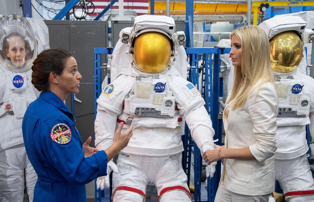 jsc2018e083423 – (Sept. 20, 2018) – NASA Astronaut Nicole Mann explains how spacesuits work to Advisor to the President Ivanka Trump during a visit to NASA’s Johnson Space Center.