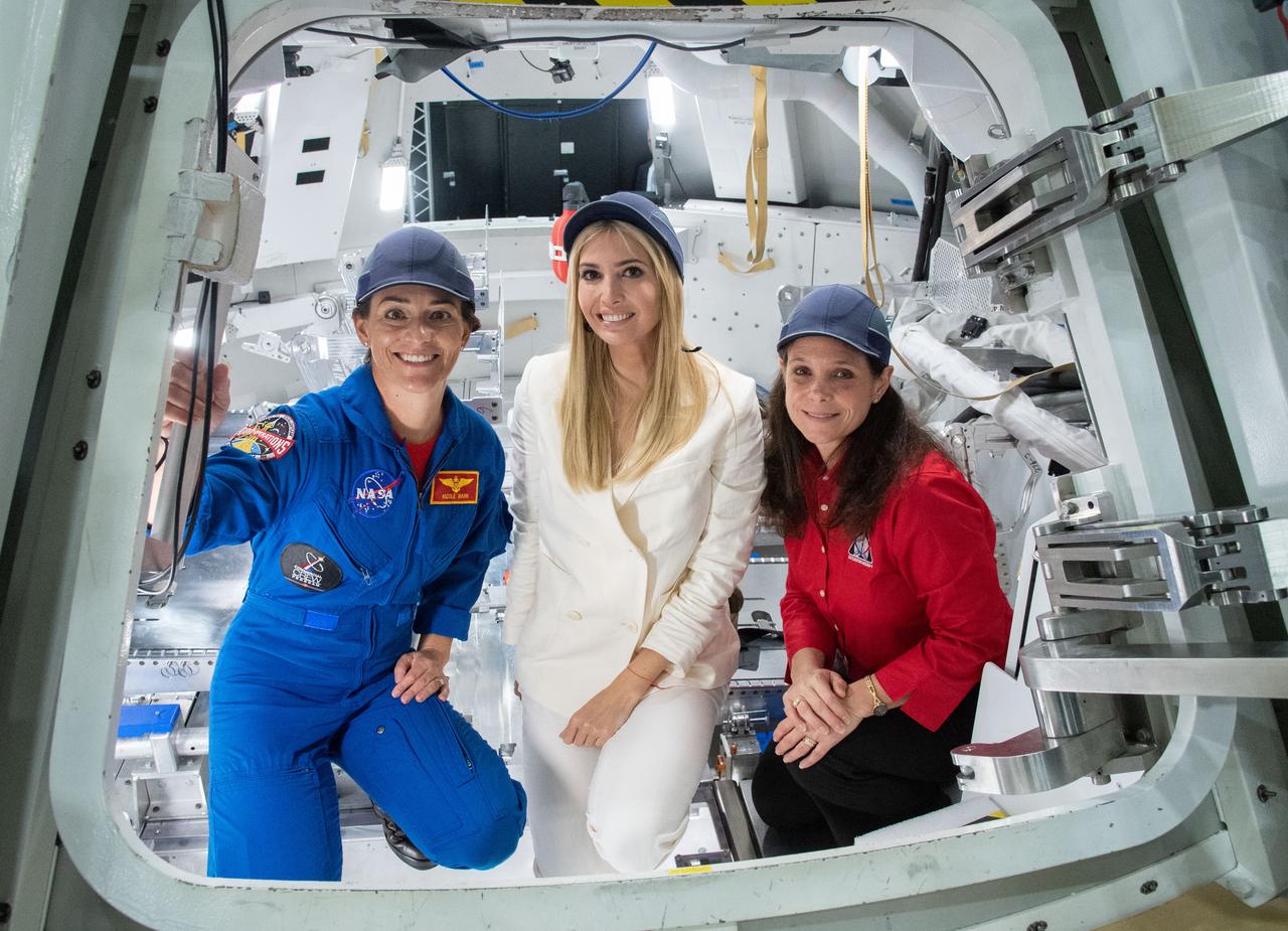 jsc2018e083425 – (Sept. 20, 2018) – NASA Astronaut Nicole Mann, Orion Crew and Service Modules Manager Laura Kearney, and Advisor to the President Ivanka Trump pose inside a mockup of the Orion Spacecraft during a visit to NASA’s Johnson Space Center.