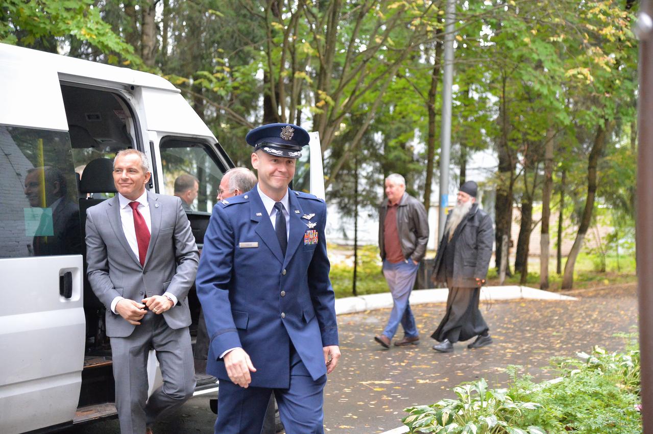 At the Gagarin Cosmonaut Training Center in Star City, Russia, Expedition 57 prime crewmember Nick Hague of NASA (foreground) arrives for crew departure ceremonies Sept. 25 before he and his crewmates left for their launch site in Baikonur, Kazakhstan for final pre-launch training. Following Hague out of their van is backup crewmember David Saint-Jacques of the Canadian Space Agency. Hague and Alexey Ovchinin of Roscosmos will launch Oct. 11 from the Baikonur Cosmodrome in Kazakhstan on the Soyuz MS-10 spacecraft for a six-month mission on the International Space Station...NASA/Sarah Volkman.