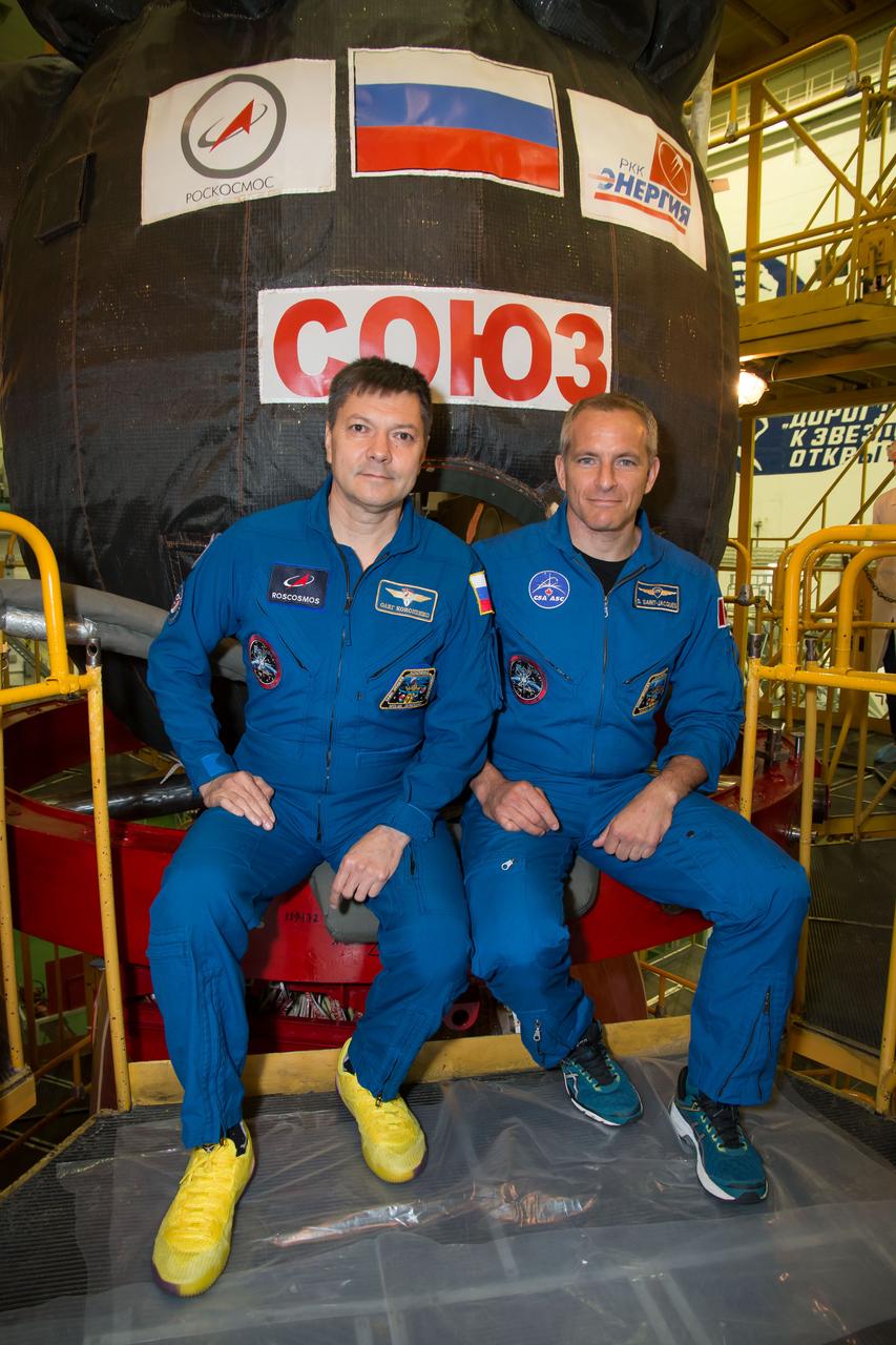 jsc2018e084485 - At the Baikonur Cosmodrome in Kazakhstan, Expedition 57 backup crewmembers Oleg Kononenko of Roscosmos and David Saint-Jacques of the Canadian Space Agency pose for pictures in front of the Soyuz MS-10 spacecraft Sept. 26 as part of pre-launch training. They are the backups to Alexey Ovchinin of Roscosmos and Nick Hague of NASA, who will launch Oct. 11 in the Soyuz MS-10 from the Baikonur Cosmodrome for a six-month mission on the International Space Station...NASA/Victor Zelentsov.