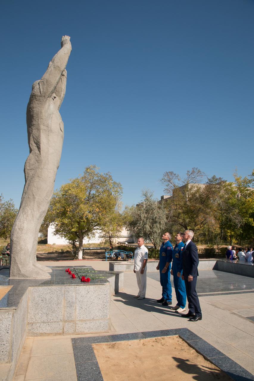 jsc2018e084638 - During a tour of the city of Baikonur, Kazakhstan, Expedition 57 backup crewmembers David Saint-Jacques of the Canadian Space Agency and Oleg Kononenko of Roscosmos pay homage to Yuri Gagarin, the first human to fly in space, as they laid flowers at his statue during traditional pre-launch ceremonies Sept. 27. They are the backups to the prime crew, Alexey Ovchinin of Roscosmos and Nick Hague of NASA, who will launch Oct. 11 on the Soyuz MS-10 spacecraft from the Baikonur Cosmodrome in Kazakhstan for a six-month mission on the International Space Station...NASA/Victor Zelentsov.