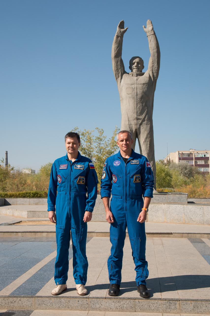 jsc2018e084639 - During a tour of the city of Baikonur, Kazakhstan, Expedition 57 backup crewmembers Oleg Kononenko of Roscosmos (left) and David Saint-Jacques of the Canadian Space Agency (right) pose for pictures Sept. 27 at the statue of Yuri Gagarin, the first human to fly in space, during traditional pre-launch ceremonies. They are the backups to the prime crew, Alexey Ovchinin of Roscosmos and Nick Hague of NASA, who will launch Oct. 11 on the Soyuz MS-10 spacecraft from the Baikonur Cosmodrome in Kazakhstan for a six-month mission on the International Space Station...NASA/Victor Zelentsov.