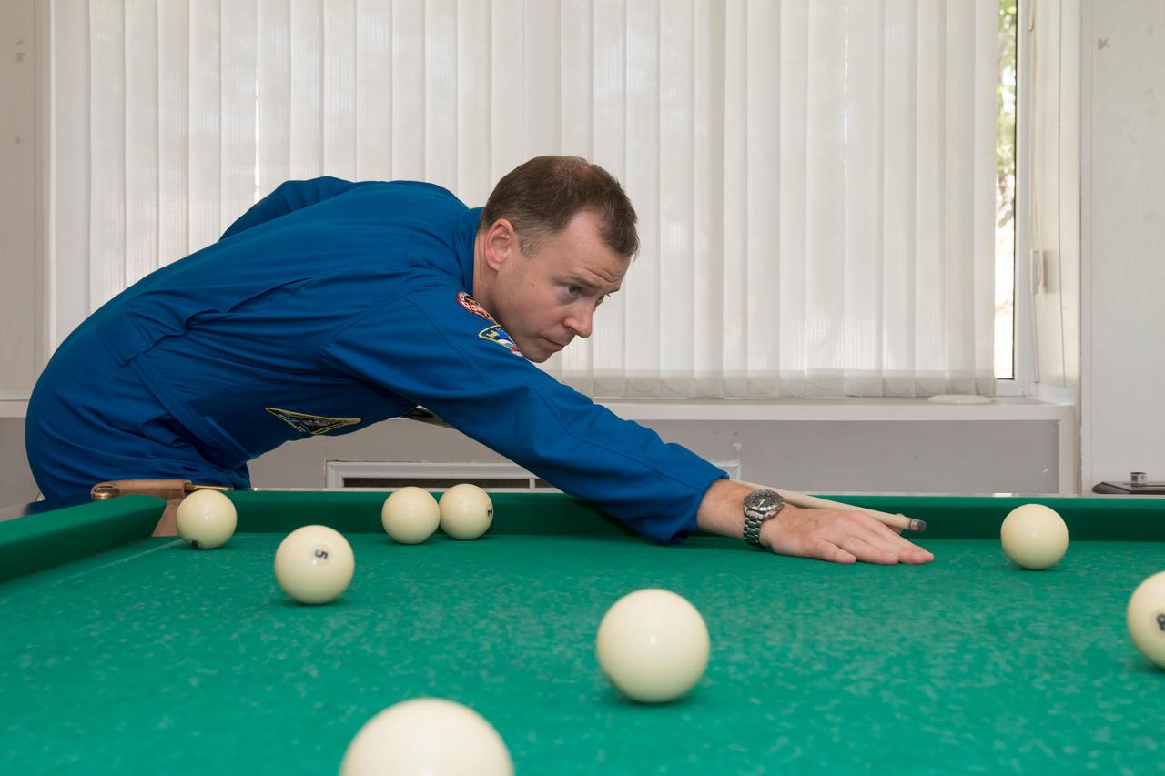 jsc2018e085896 (Oct. 3, 2018) --- Expedition 57 crew member Nick Hague of NASA plays a game of billiards as part of the traditional pre-launch activities, Wednesday, Oct. 3, 2018 at the Cosmonaut Hotel in Baikonur, Kazakhstan. Hague and Alexey Ovchinin of Roscosmos are scheduled to launch on Oct. 11 onboard the Soyuz MS-10 spacecraft from the Baikonur Cosmodrome in Kazakhstan for a six-month mission on the International Space Station. Photo Credit: (NASA/Victor Zelentsov)