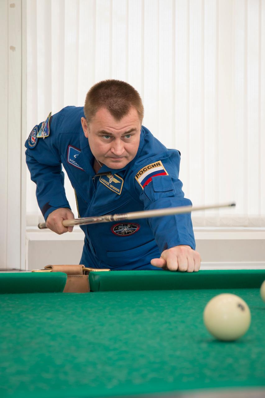 jsc2018e085897 (Oct. 3, 2018) --- Expedition 57 crew member Alexey Ovchinin of Roscosmos plays a game of billiards as part of the traditional pre-launch activities, Wednesday, Oct. 3, 2018 at the Cosmonaut Hotel in Baikonur, Kazakhstan. Ovchinin and Nick Hague of NASA are scheduled to launch on Oct. 11 onboard the Soyuz MS-10 spacecraft from the Baikonur Cosmodrome in Kazakhstan for a six-month mission on the International Space Station. Photo Credit: (NASA/Victor Zelentsov)