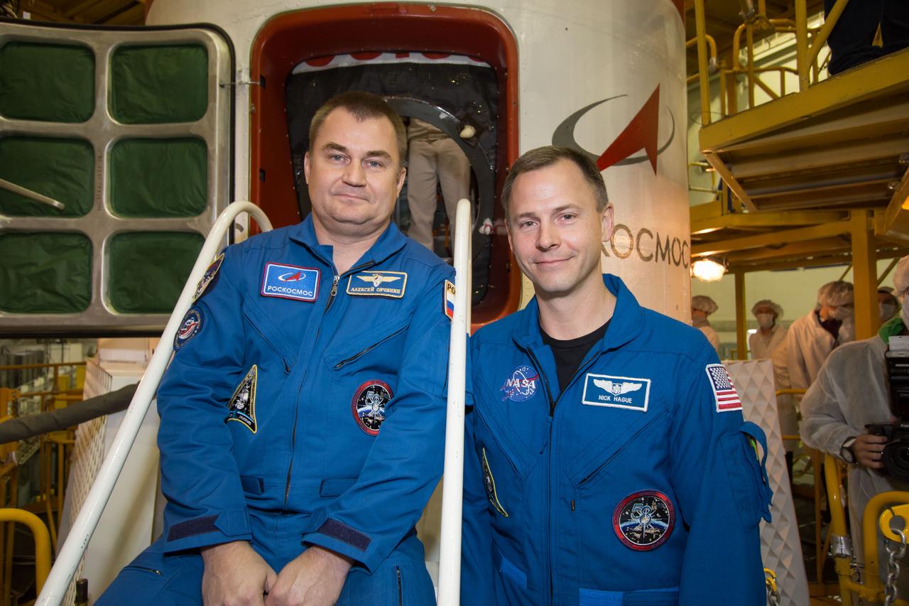 At the Baikonur Cosmodrome in Kazakhstan, Expedition 57 crewmembers Alexey Ovchinin of Roscosmos (left) and Nick Hague of NASA (right) pose for pictures Oct. 6 in front of the Soyuz MS-10 spacecraft. They will launch Oct. 11 from the Baikonur Cosmodrome on the Soyuz MS-10 spacecraft for a six-month mission on the International Space Station...NASA/Victor Zelentsov.