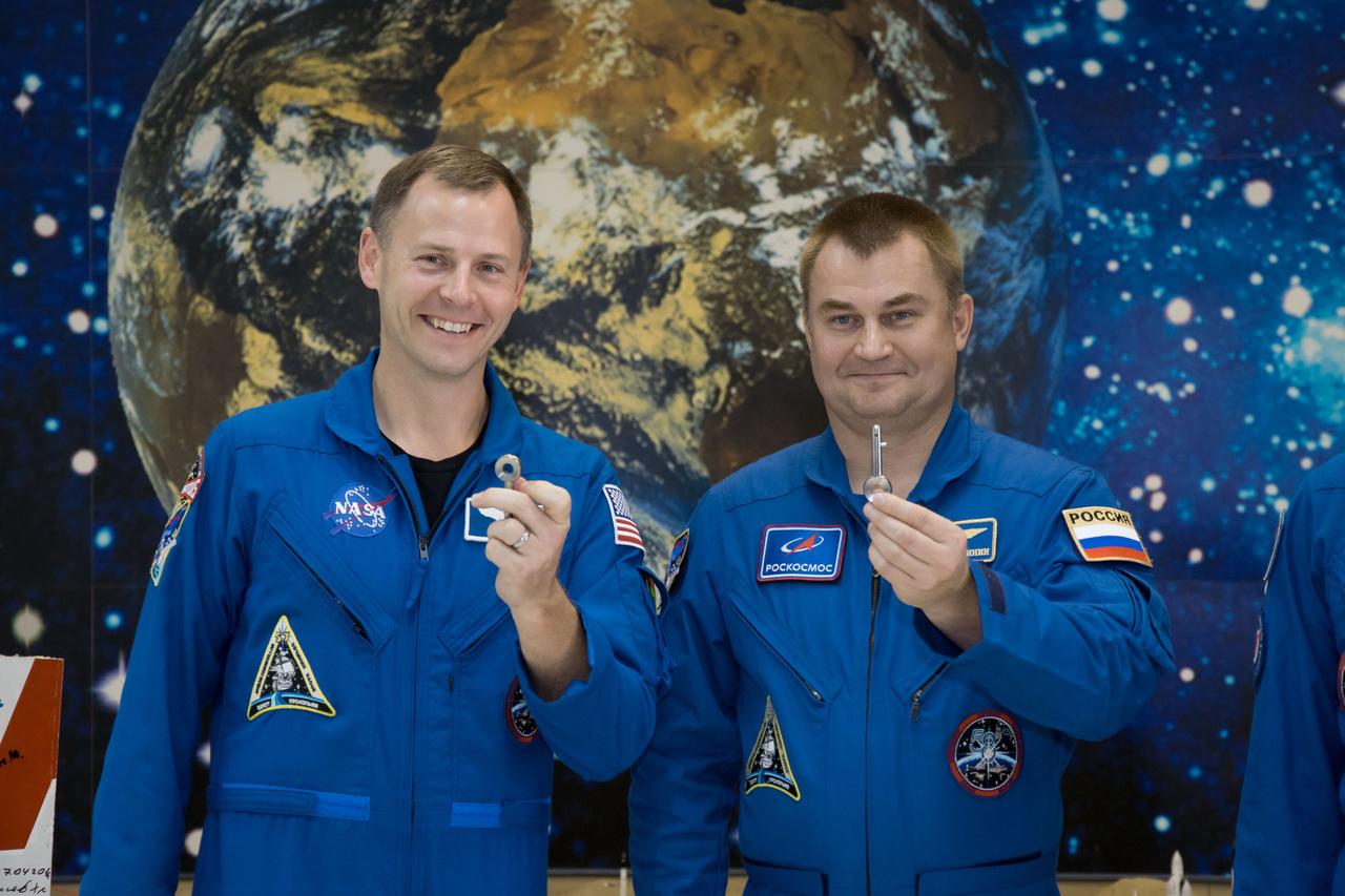 At the Baikonur Cosmodrome Museum in Kazakhstan, Expedition 57 Nick Hague of NASA (left) and Alexey Ovchinin of Roscosmos (right) display “launch keys” they were presented Oct. 6 during a traditional pre-launch tour of the facility. Hague and Ovchinin will launch Oct. 11 from the Baikonur Cosmodrome on the Soyuz MS-10 spacecraft for a six-month mission on the International Space Station...NASA/Victor Zelentsov.
