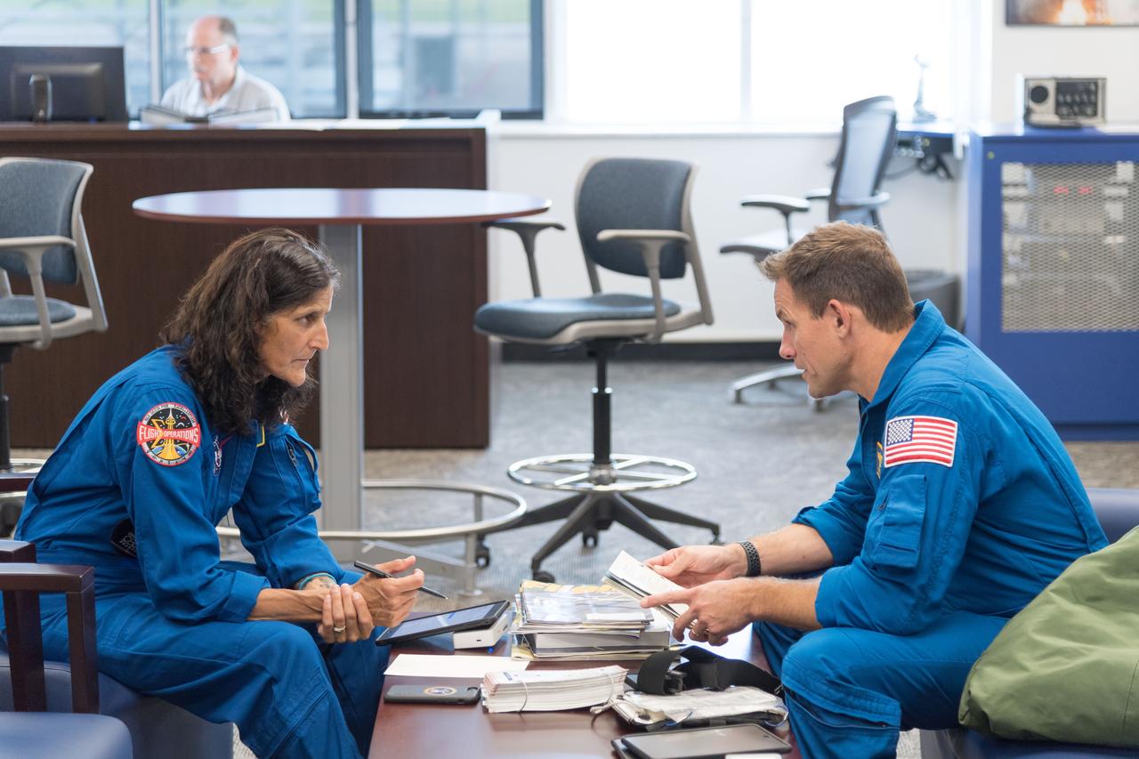 NASA commercial crew astronauts Josh Cassada and Suni Williams prepare for T-38 training flights at Ellington Field Joint Reserve Base in Houston. Cassada and Williams are assigned to the Boeing Starliner’s second crewed flight.
