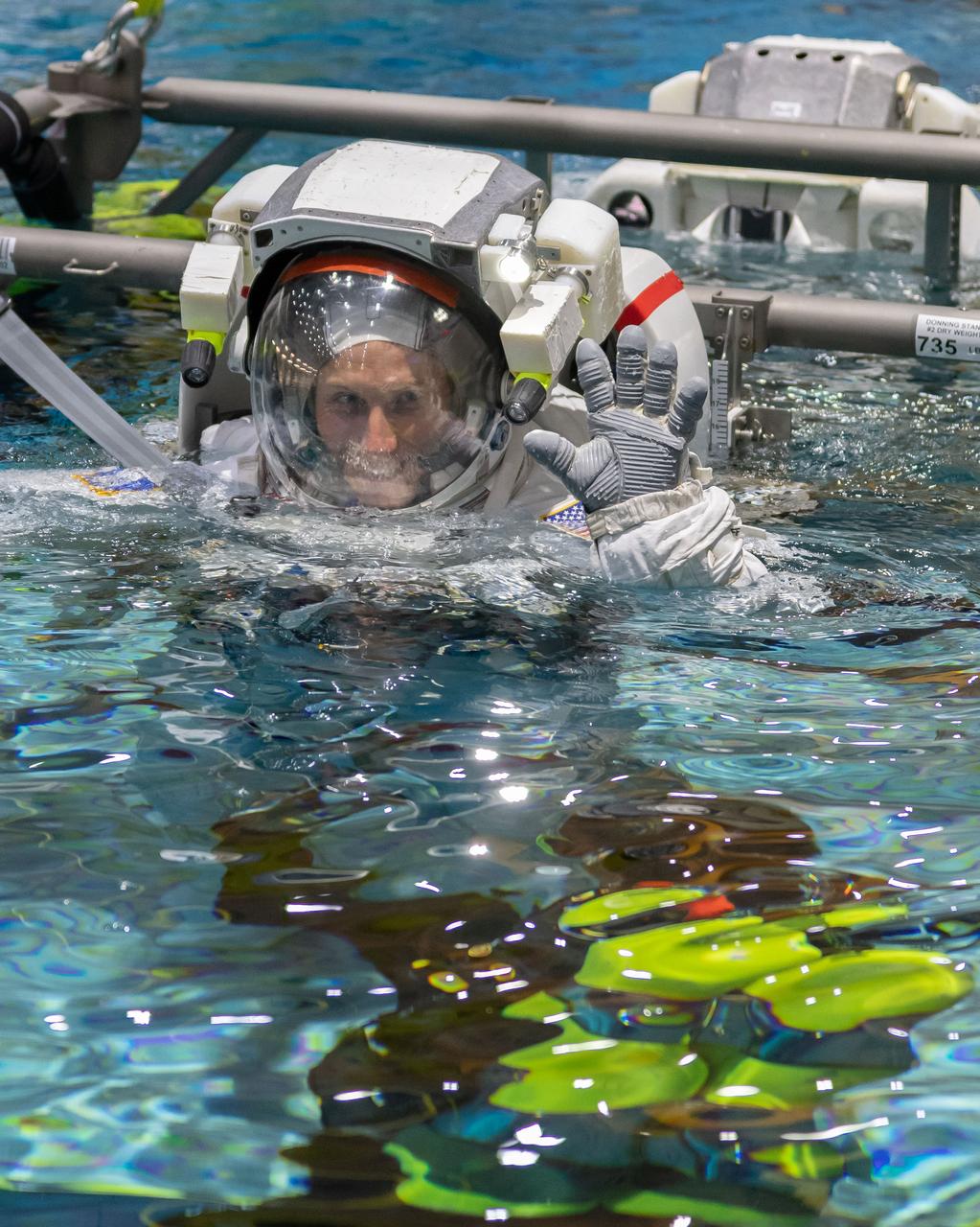 jsc2018e094739 (November 05, 2018) --- 2017 NASA astronaut candidate Warren Hoburg is lowered into the training pool for spacewalk training at NASA Johnson Space Center’s Neutral Buoyancy Laboratory in Houston. Photo Credit: (NASA/Josh Valcarcel)