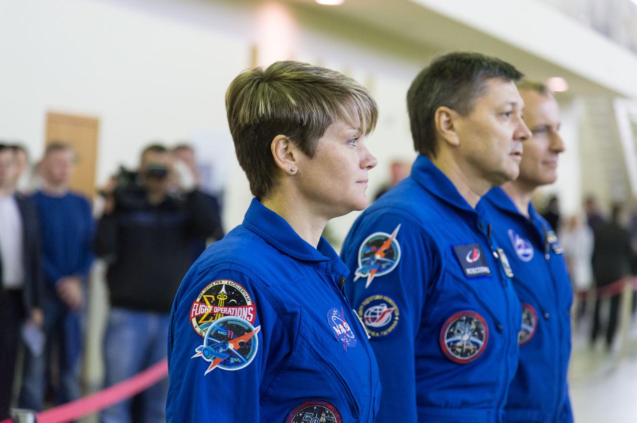 jsc2018e094962 - At the Gagarin Cosmonaut Training Center in Star City, Russia, Expedition 58 crewmembers Anne McClain of NASA (foreground), Oleg Kononenko of Roscosmos (center) and David Saint-Jacques of the Canadian Space Agency (right) report for their qualification exams Nov. 13. They will launch Dec. 3 on the Soyuz MS-11 spacecraft from the Baikonur Cosmodrome in Kazakhstan for a six-and-a-half month mission on the International Space Station...NASA/Sarah Volkman.