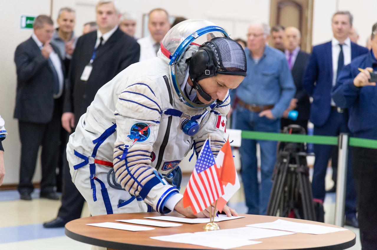 jsc2018e095176 - At the Gagarin Cosmonaut Training Center in Star City, Russia, Expedition 58 crewmember David Saint-Jacques of the Canadian Space Agency signs in for the final day of qualification exams Nov. 14. Saint-Jacques, Oleg Kononenko of Roscosmos and Anne McClain of NASA will launch Dec. 3 on the Soyuz MS-11 spacecraft from the Baikonur Cosmodrome in Kazakhstan for a six-and-a-half month mission on the International Space Station...NASA/Sarah Volkman.