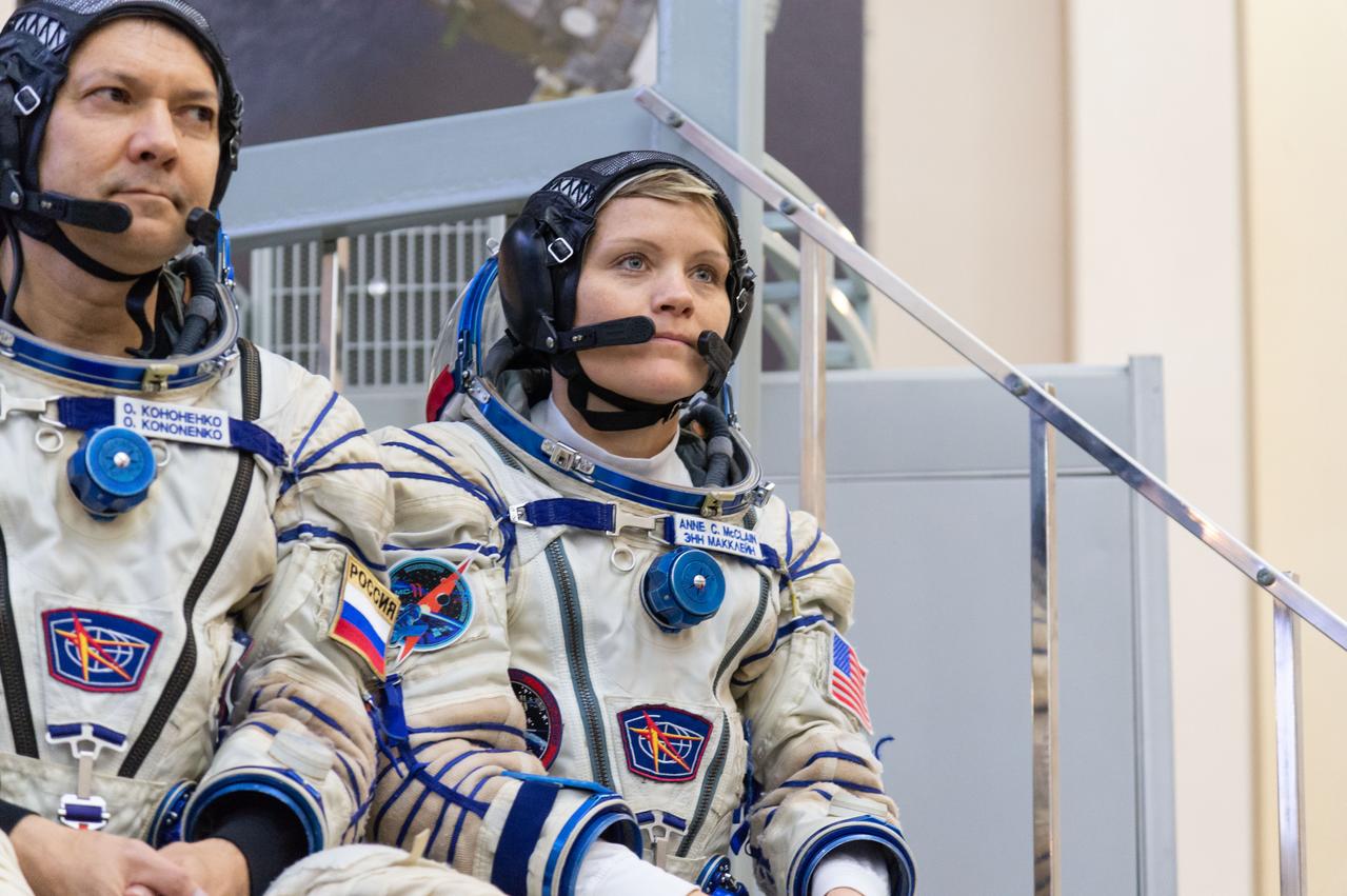 jsc2018e095178 - At the Gagarin Cosmonaut Training Center in Star City, Russia, Expedition 58 crewmembers Oleg Kononenko of Roscosmos (left) and Anne McClain of NASA (right) listen to a reporter’s question Nov. 14 at the conclusion of qualification exams. Along with David Saint-Jacques of the Canadian Space Agency, they will launch Dec. 3 on the Soyuz MS-11 spacecraft from the Baikonur Cosmodrome in Kazakhstan for a six-and-a-half month mission on the International Space Station...NASA/Sarah Volkman.
