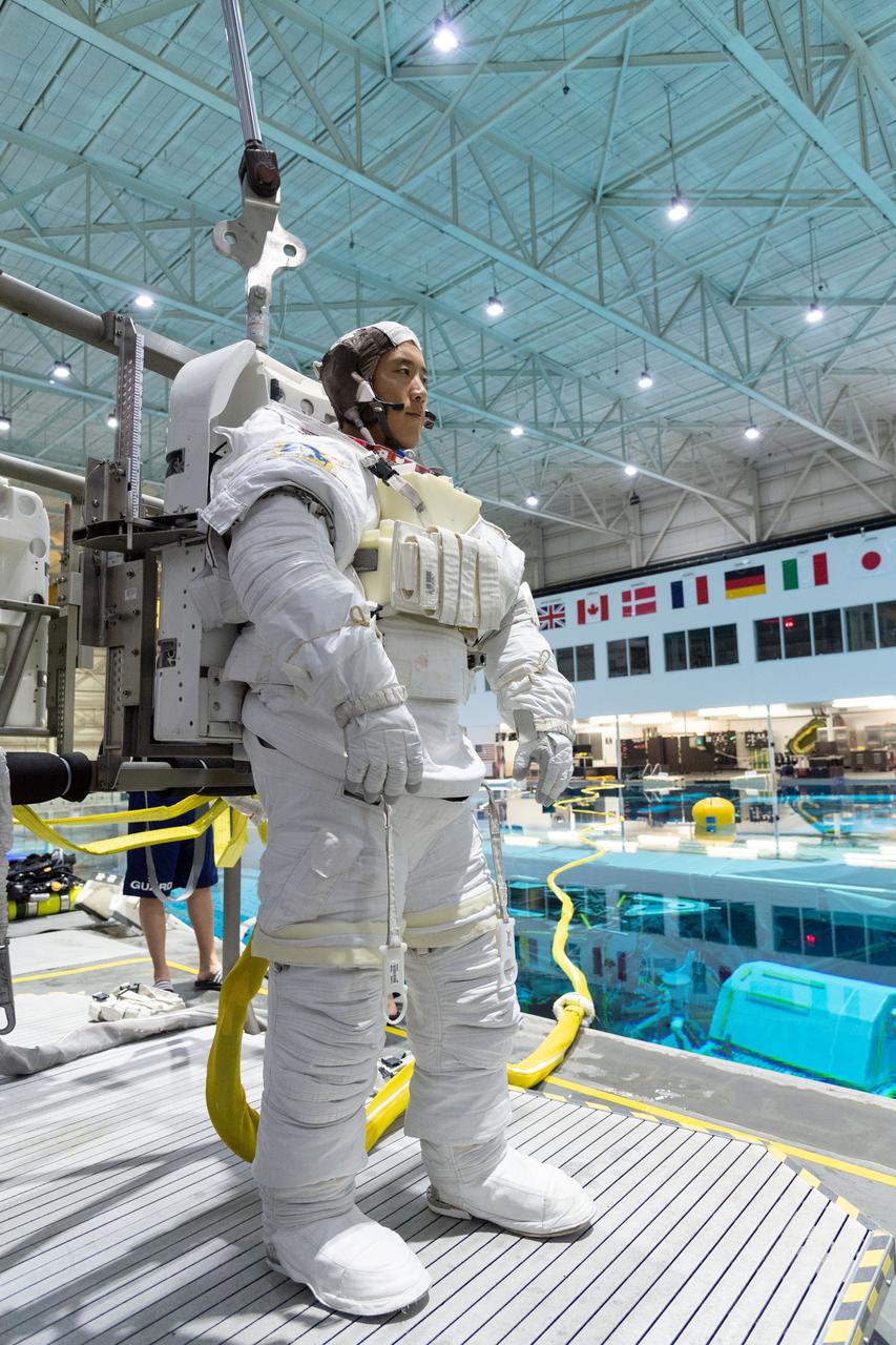 jsc2018e095924 (November 7, 2018) --- 2017 NASA astronaut candidate Jonny Kim prepares for underwater spacewalk training at NASA Johnson Space Center’s Neutral Buoyancy Laboratory in Houston. Photo Credit: (NASA/Robert Markowitz)