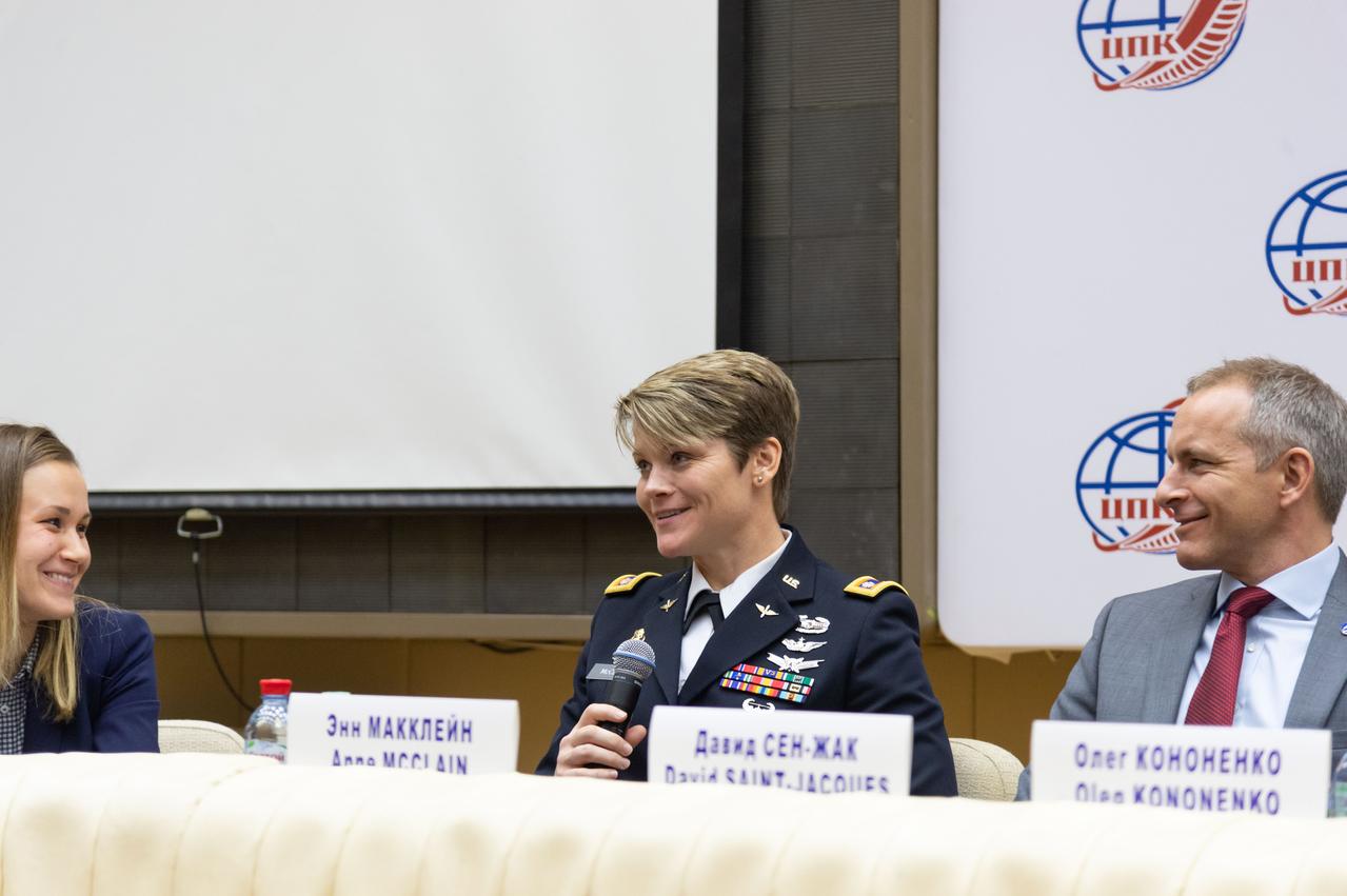 At the Gagarin Cosmonaut Training Center in Star City, Russia, Expedition 58 crewmember Anne McClain of NASA answers a reporter’s question at the crew’s news conference Nov. 15 as crewmate David Saint-Jacques of the Canadian Space Agency (right) looks on. They and Oleg Kononenko of Roscosmos will launch Dec. 3 on the Soyuz MS-11 spacecraft from the Baikonur Cosmodrome in Kazakhstan for a six-and-a-half month mission on the International Space Station...NASA/Sarah Volkman.