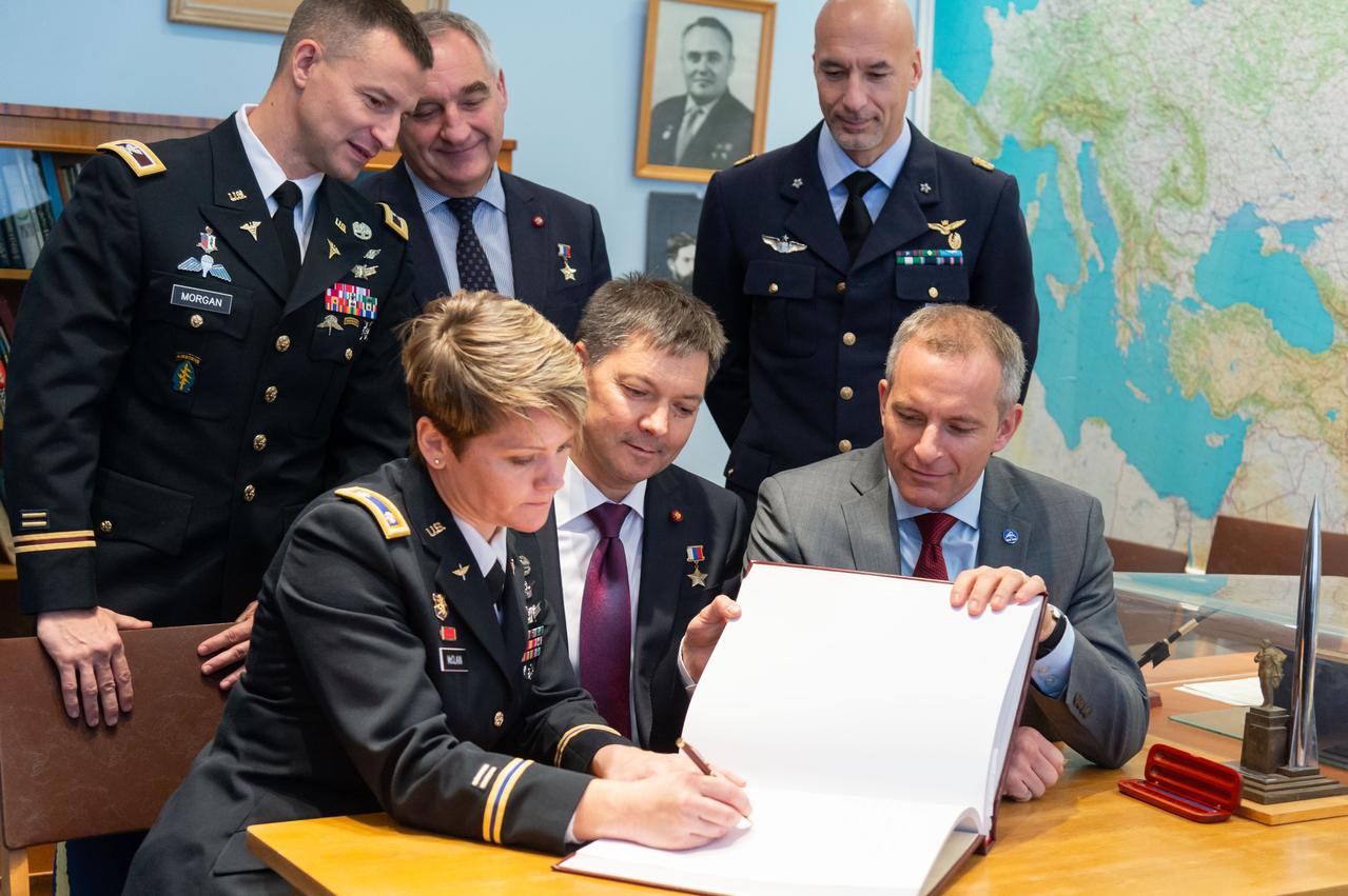 At the Gagarin Museum at the Gagarin Cosmonaut Training Center in Star City, Russia, Expedition 58 crewmembers Anne McClain of NASA (front row, left), Oleg Kononenko of Roscosmos (front row, center) and David Saint-Jacques of the Canadian Space Agency (front row, right) sign a book bearing crews’ signatures in a traditional ceremony Nov. 15. Looking on in the back row are the backup crewmembers, Drew Morgan of NASA (left), Alexander Skvortsov of Roscosmos (center) and Luca Parmitano of the European Space Agency (right). McClain, Kononenko and Saint-Jacques will launch Dec. 3 on the Soyuz MS-11 spacecraft from the Baikonur Cosmodrome in Kazakhstan for a six-and-a-half month mission on the International Space Station...NASA/Sarah Volkman.