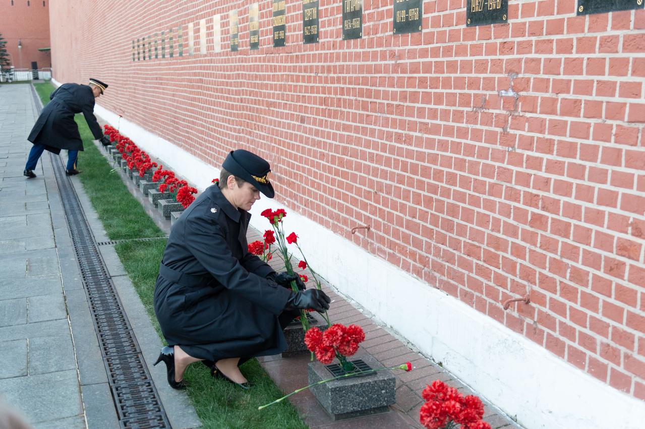 Expedition 58 prime crewmember Anne McClain of NASA (foreground) and backup crewmember Drew Morgan of NASA (top) lay flowers Nov. 15 in traditional ceremonies at the Kremlin Wall in Red Square in Moscow where Russian space icons are interred. McClain, Oleg Kononenko of Roscosmos and David Saint-Jacques of the Canadian Space Agency will launch Dec. 3 on the Soyuz MS-11 spacecraft from the Baikonur Cosmodrome in Kazakhstan for a six-and-a-half month mission on the International Space Station...NASA/Sarah Volkman.