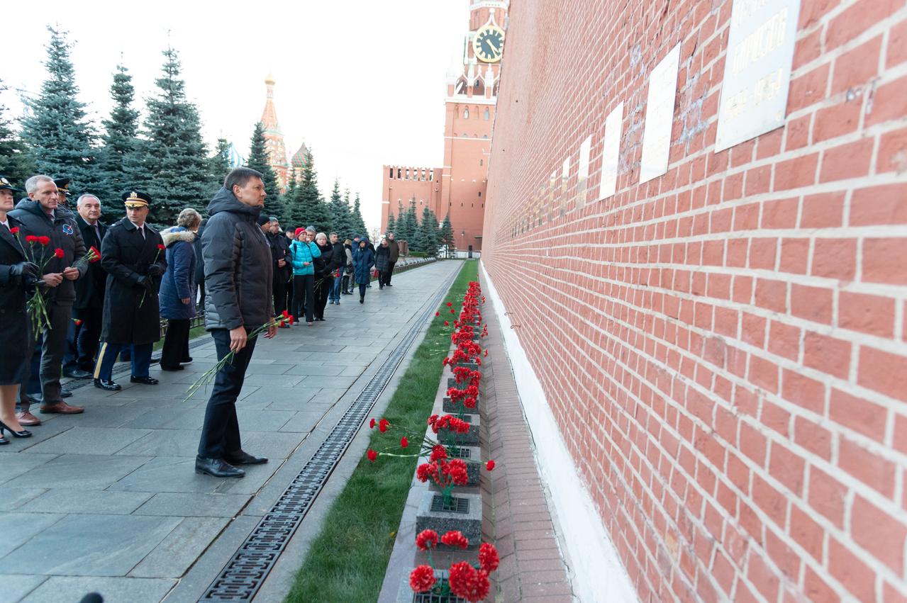 Expedition 58 crewmember Oleg Kononenko of Roscosmos pays homage in traditional ceremonies Nov. 15 at the Kremlin Wall in Red Square where Russian space icons are interred. At the far left looking on are crewmates Anne McClain of NASA and David Saint-Jacques of the Canadian Space Agency will launch with Kononenko Dec. 3 on the Soyuz MS-11 spacecraft from the Baikonur Cosmodrome in Kazakhstan for a six-and-a-half month mission on the International Space Station...NASA/Sarah Volkman.