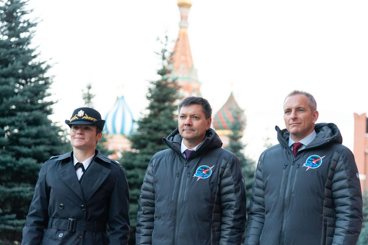 With the onion domes of St. Basil’s Cathedral serving as a backdrop, Expedition 58 crewmembers Anne McClain of NASA (left), Oleg Kononenko of Roscosmos (center) and David Saint-Jacques of the Canadian Space Agency (right) pose for pictures at the Kremlin Wall in Red Square in Moscow Nov. 15 in traditional ceremonies. They will launch Dec. 3 on the Soyuz MS-11 spacecraft from the Baikonur Cosmodrome in Kazakhstan for a six-and-a-half month mission on the International Space Station...NASA/Sarah Volkman.