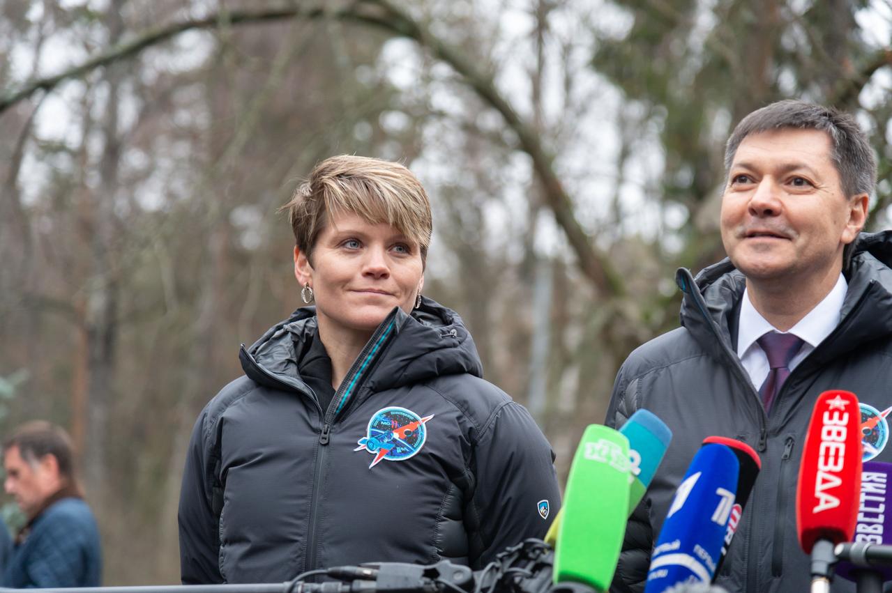 jsc2018e097268 - Expedition 58 crewmember Anne McClain of NASA (left) looks on as crewmate Oleg Kononenko of Roscosmos answer reporters’ questions Nov. 19 at the Gagarin Cosmonaut Training Center in Star City, Russia before boarding a plane to fly to their launch site in Baikonur, Kazakhstan. McClain, Kononenko and David Saint-Jacques of the Canadian Space Agency will launch Dec. 3 on the Soyuz MS-11 spacecraft from the Baikonur Cosmodrome in Kazakhstan for a six-and-a-half month mission on the International Space Station.  NASA/Sarah Volkman 