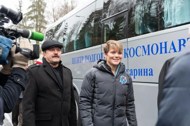 NASA image: jsc2018e097271 - At the Gagarin Cosmonaut Training Center in Star City, Russia, Expedition 58 crewmember Anne McClain of NASA (right) walks to a waiting bus Nov. 19 that will take her and her crewmates to a nearby airfield for a flight to their launch sit