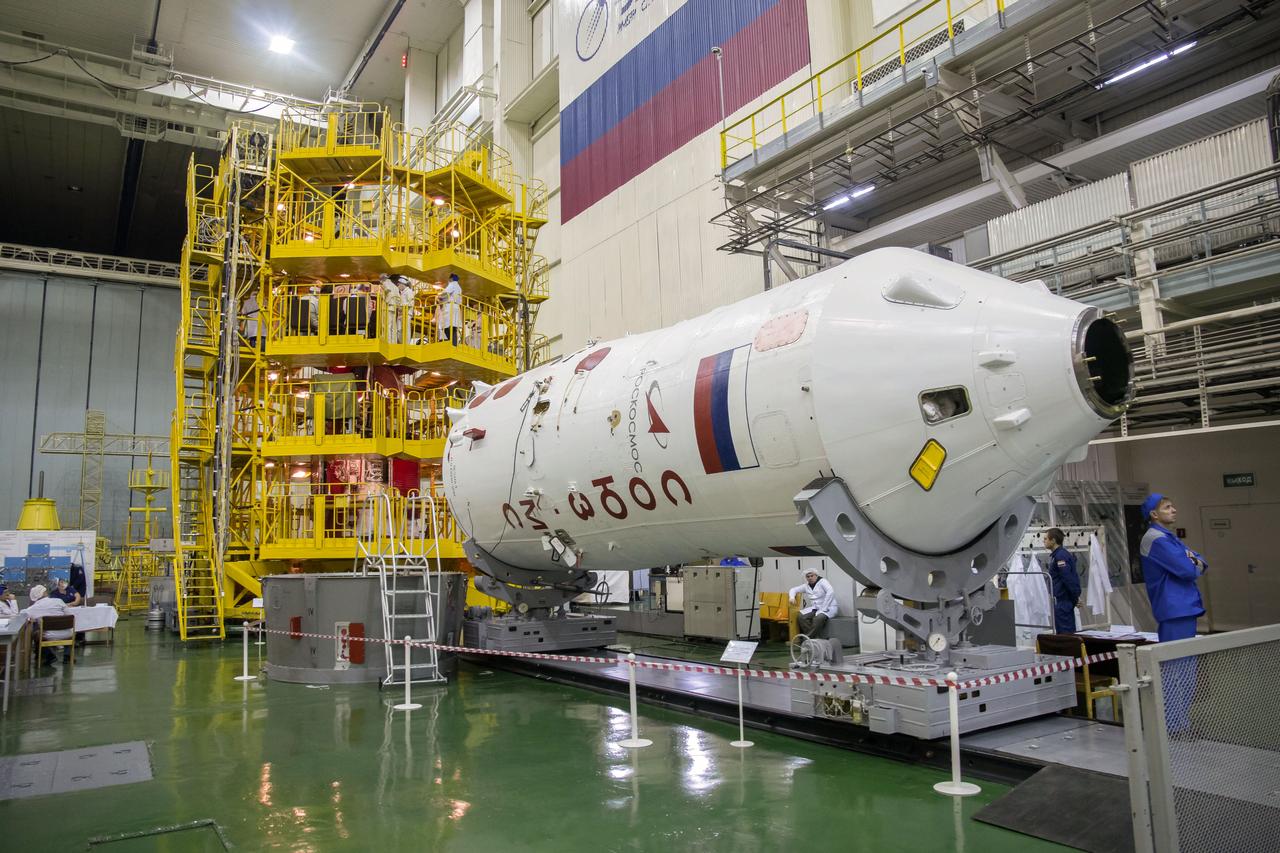 jsc2018e097288 - In the Integration Facility at the Baikonur Cosmodrome in Kazakhstan, the upper stage of a Soyuz-FG booster is prepared for launch Nov. 20 to carry the Expedition 58 crew to orbit. Anne McClain of NASA, Oleg Kononenko of Roscosmos and David Saint-Jacques of the Canadian Space Agency will launch Dec. 3 on the Soyuz MS-11 spacecraft from the Baikonur Cosmodrome for a six-and-a-half month mission on the International Space Station...NASA/Victor Zelentsov.