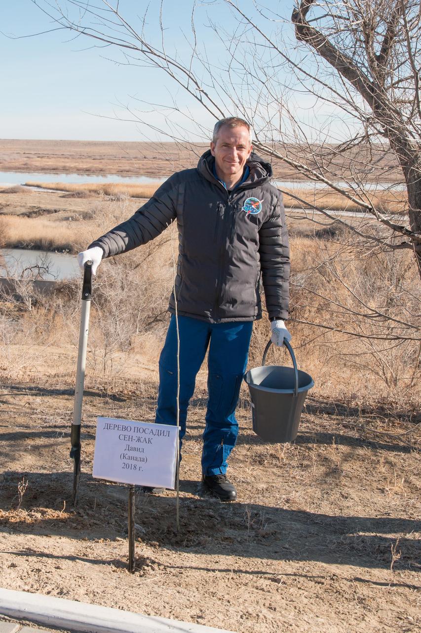 jsc2018e097777 - At the Cosmonaut Hotel crew quarters in Baikonur, Kazakhstan, Expedition 58 crewmember David Saint-Jacques of the Canadian Space Agency poses for pictures Nov. 27 after planting a tree in his name in traditional pre-launch activities. Saint-Jacques, Anne McClain of NASA and Oleg Kononenko of Roscosmos will launch Dec. 3 on the Soyuz MS-11 spacecraft from the Baikonur Cosmodrome in Kazakhstan for a six-and-a-half month mission on the International Space Station...NASA/Victor Zelentsov.