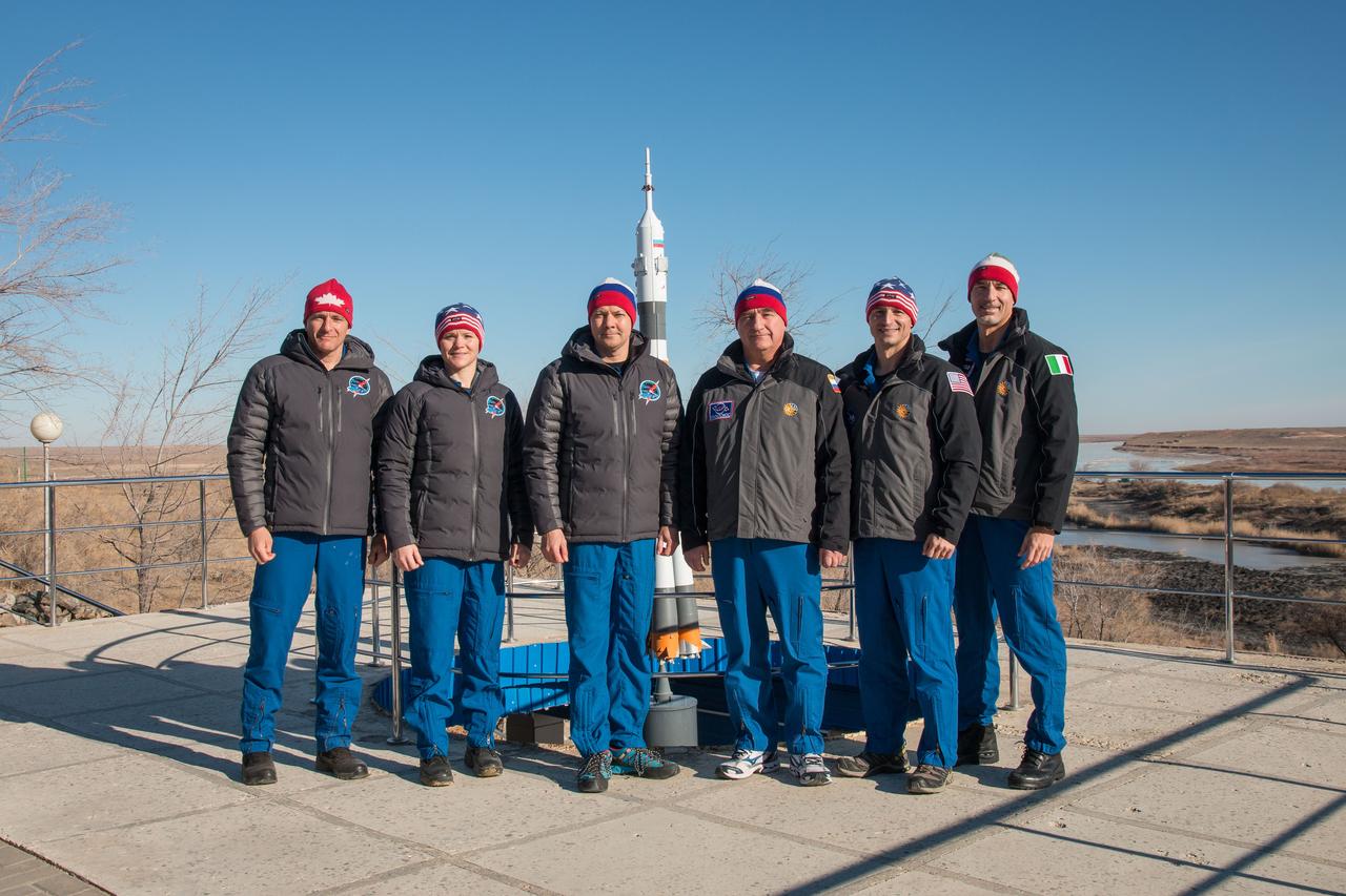 jsc2018e097782 - At their Cosmonaut Hotel crew quarters in Baikonur, Kazakhstan, the Expedition 58 prime and backup crewmembers pose for pictures Nov. 27 as part of their pre-launch training activities. From left to right are the prime crewmembers, David Saint-Jacques of the Canadian Space Agency, Anne McClain of NASA and Oleg Kononenko of Roscosmos, and the backup crew, Alexander Skvortsov of Roscosmos, Drew Morgan of NASA and Luca Parmitano of the European Space Agency. McClain, Saint-Jacques and Kononenko will launch Dec. 3 on the Soyuz MS-11 spacecraft from the Baikonur Cosmodrome in Kazakhstan for a six-and-a-half month mission on the International Space Station...NASA/Victor Zelentsov.
