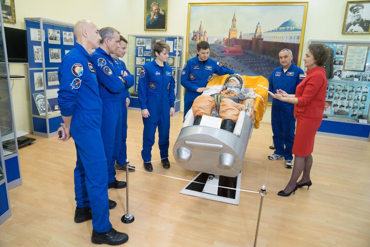 jsc2018e098094 - At the Baikonur Cosmodrome Museum in Kazakhstan, the Expedition 58 prime and backup crewmembers are shown a model of a Soyuz spacecraft seat and a mock cosmonaut during a tour of the facility Nov. 29. From left to right are Luca Parmitano of the European Space Agency, David Saint-Jacques of the Canadian Space Agency, Drew Morgan of NASA, Anne McClain of NASA, Oleg Kononenko of Roscosmos and Alexander Skvortsov of Roscosmos. McClain, Saint-Jacques and Kononenko will launch Dec. 3 in the Soyuz MS-11 spacecraft from the Baikonur Cosmodrome in Kazakhstan for a six-and-a-half month mission on the International Space Station...NASA/Victor Zelentsov.