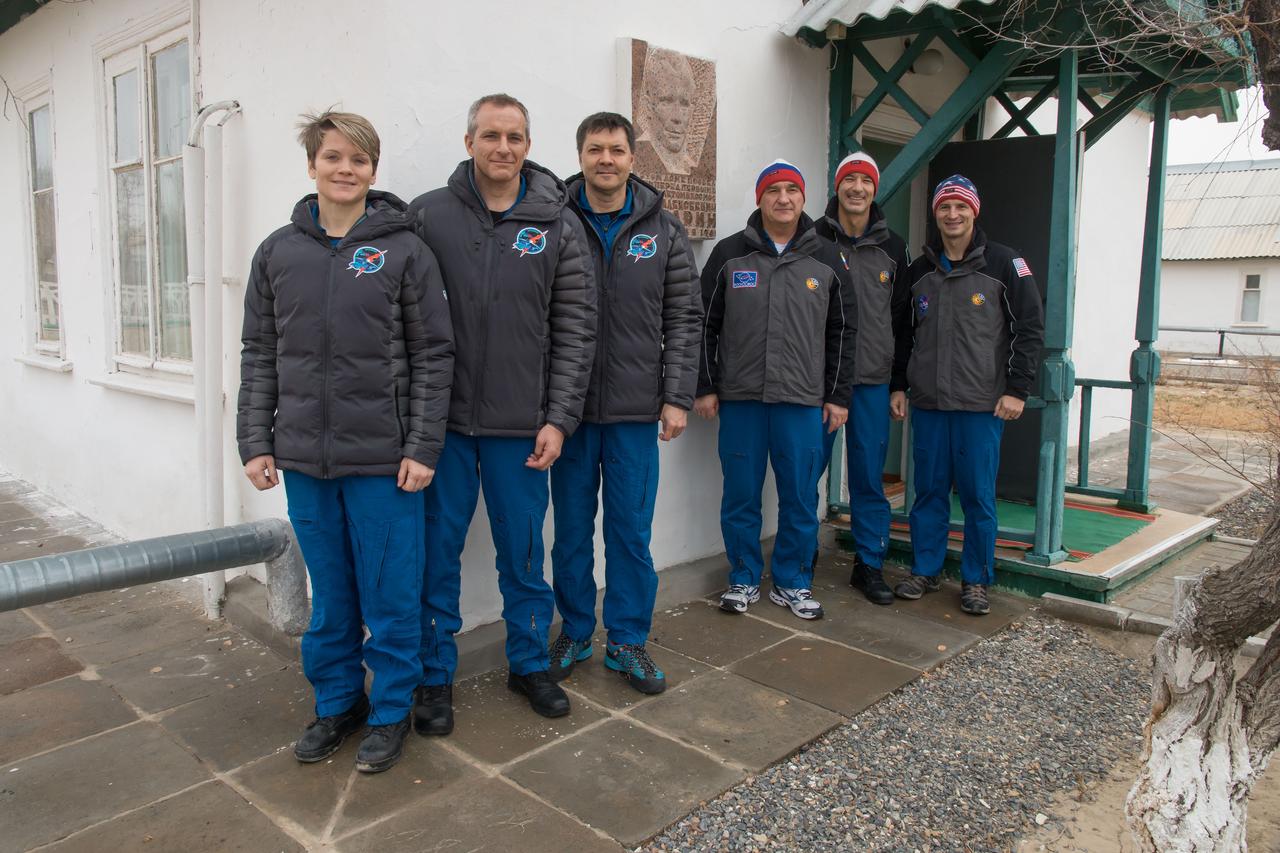 jsc2018e098098 - At the Baikonur Cosmodrome in Kazakhstan, the Expedition 58 prime and backup crewmembers pose for pictures Nov. 29 in front of the cottage where Yuri Gagarin slept on the night before his historic launch April 12, 1961 to become the first human to fly in space. From left to right are prime crewmembers Anne McClain of NASA, David Saint-Jacques of the Canadian Space Agency and Oleg Kononenko of Roscosmos and the backup crew, Alexander Skvortsov of Roscosmos, Luca Parmitano of the European Space Agency and Drew Morgan of NASA. McClain, Saint-Jacques and Kononenko will launch Dec. 3 in the Soyuz MS-11 spacecraft from the Baikonur Cosmodrome in Kazakhstan for a six-and-a-half month mission on the International Space Station...NASA/Victor Zelentsov.