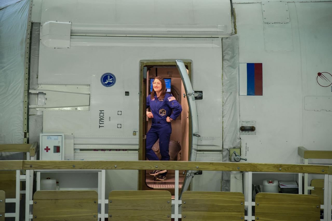 jsc2019e003766 (Feb. 19, 2019) --- At the Gagarin Cosmonaut Training Center in Star City, Russia, Expedition 59 crew member Christina Koch of NASA is seen in the hatchway of a Russian segment simulator Feb. 19 during the first of two days of final pre-launch qualification exams. Koch, Alexey Ovchinin of Roscosmos and Nick Hague of NASA will launch March 14, U.S. time, from the Baikonur Cosmodrome in Kazakhstan on the Soyuz MS-12 spacecraft for a six-and-a-half month mission on the International Space Station. Credit: NASA/Beth Weissinger