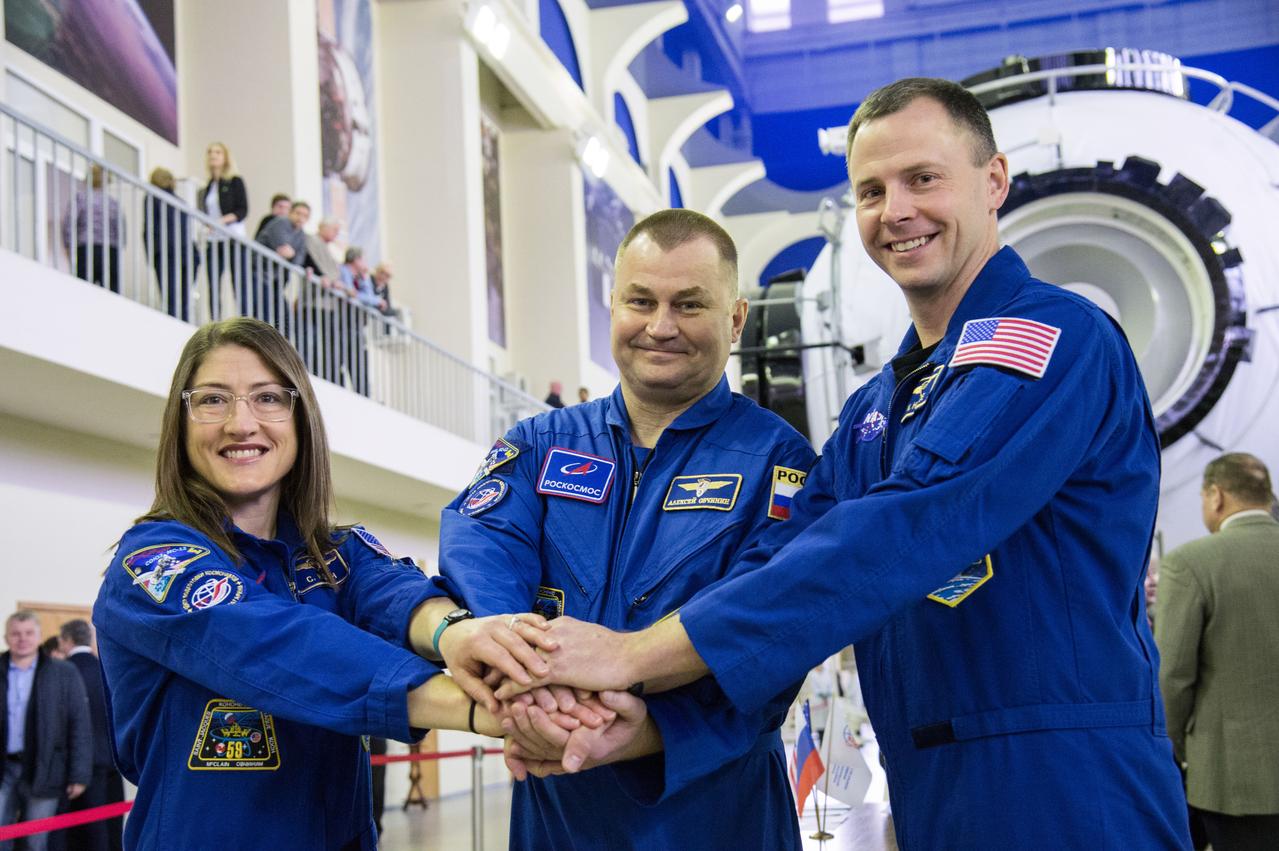 jsc2019e003767 (Feb. 19, 2019) --- At the Gagarin Cosmonaut Training Center in Star City, Russia, Expedition 59 crew members Christina Koch of NASA (left), Alexey Ovchinin of Roscosmos (center) and Nick Hague of NASA (right) pose for pictures Feb. 19 during the first of two days of final pre-launch qualification exams. They will launch March 14, U.S. time, from the Baikonur Cosmodrome in Kazakhstan on the Soyuz MS-12 spacecraft for a six-and-a-half month mission on the International Space Station. Credit: NASA/Beth Weissinger