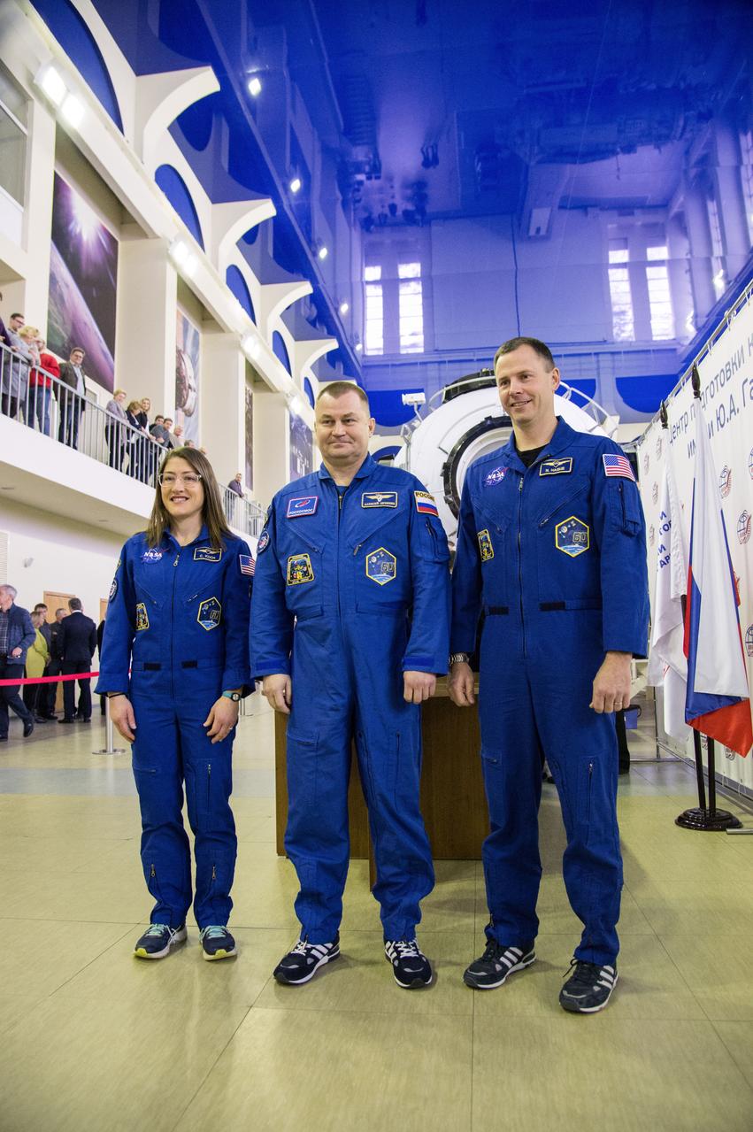 jsc2019e003769 (Feb. 19, 2019) --- At the Gagarin Cosmonaut Training Center in Star City, Russia, Expedition 59 crew members Christina Koch of NASA (left), Alexey Ovchinin of Roscosmos (center) and Nick Hague of NASA (right) pose for pictures Feb. 19 during the first of two days of final pre-launch qualification exams. They will launch March 14, U.S. time, from the Baikonur Cosmodrome in Kazakhstan on the Soyuz MS-12 spacecraft for a six-and-a-half month mission on the International Space Station. Credit: NASA/Beth Weissinger