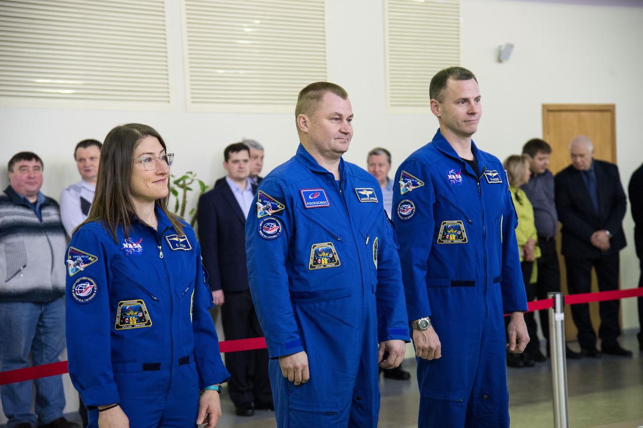 jsc2019e003772 (Feb. 19, 2019) --- At the Gagarin Cosmonaut Training Center in Star City, Russia, Expedition 59 crew members Christina Koch of NASA (left), Alexey Ovchinin of Roscosmos (center) and Nick Hague of NASA (right) report to Russian space officials Feb. 19 during the first of two days of final pre-launch qualification exams. They will launch March 14, U.S. time, from the Baikonur Cosmodrome in Kazakhstan on the Soyuz MS-12 spacecraft for a six-and-a-half month mission on the International Space Station. Credit: NASA/Beth Weissinger