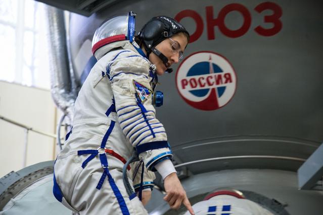NASA image: Christina Koch of NASA boards a Soyuz spacecraft simulator