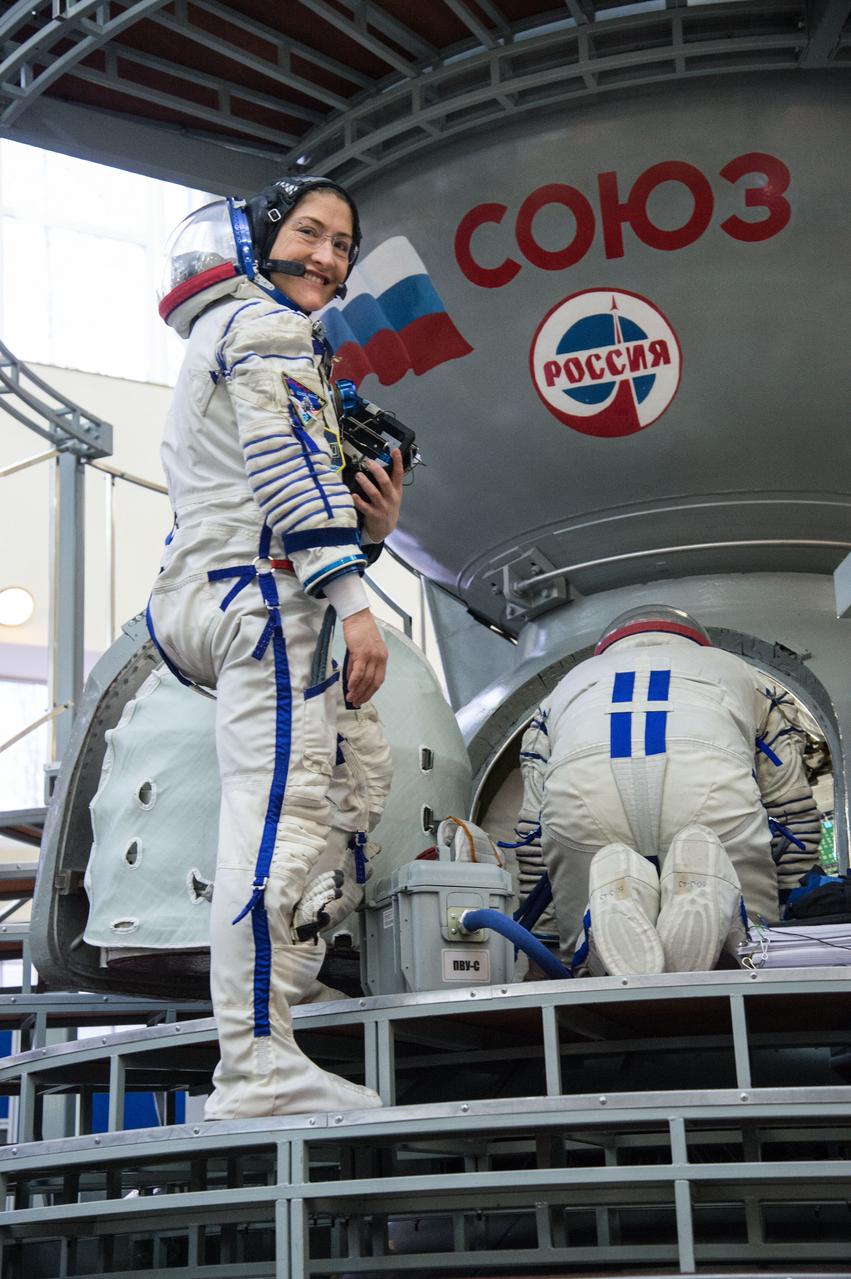 At the Gagarin Cosmonaut Training Center in Star City, Russia, Expedition 59 crewmember Christina Koch of NASA boards a Soyuz spacecraft simulator Feb. 20 during the second day of final pre-launch qualifications exams. Koch, Nick Hague of NASA and Alexey Ovchinin of Roscosmos will launch March 14, U.S. time, in the Soyuz MS-12 spacecraft from the Baikonur Cosmodrome in Kazakhstan for a six-and-a-half month mission on the International Space Station.  NASA/Beth Weissinger 