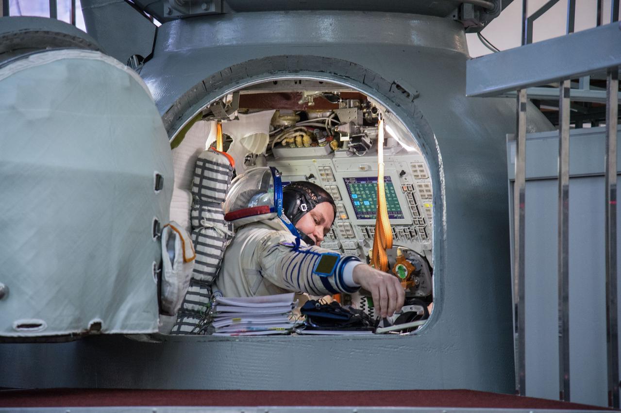 jsc2019e004060 (Feb. 20, 2019) --- At the Gagarin Cosmonaut Training Center in Star City, Russia, Expedition 59 crew member Alexey Ovchinin of Roscosmos is seen inside a Soyuz spacecraft simulator Feb. 20 during the second day of final pre-launch qualification exams. Ovchinin and crewmates Nick Hague and Christina Koch of NASA will launch March 14, U.S. time, in the Soyuz MS-12 spacecraft from the Baikonur Cosmodrome in Kazakhstan for a six-and-a-half month mission on the International Space Station. Credit: NASA/Beth Weissinger