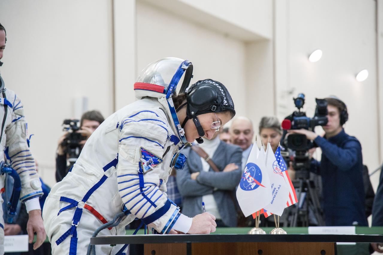 jsc2019e004065 (Feb. 20, 2019) --- At the Gagarin Cosmonaut Training Center in Star City, Russia, Expedition 59 crew member Christina Koch of NASA signs in for the second day of final pre-launch qualification exams Feb. 20. Koch, Nick Hague of NASA and Alexey Ovchinin of Roscosmos will launch March 14, U.S. time, in the Soyuz MS-12 spacecraft from the Baikonur Cosmodrome in Kazakhstan for a six-and-a-half month mission on the International Space Station. Credit: NASA/Beth Weissinger