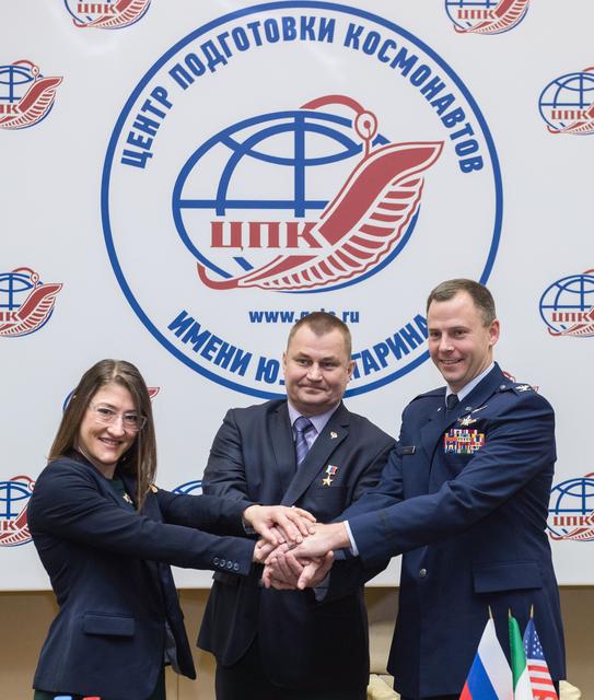 NASA image: jsc2019e004423 - At the Gagarin Cosmonaut Training Center in Star City, Russia, Expedition 59 crewmembers Christina Koch of NASA (left), Alexey Ovchinin of Roscosmos (center) and Nick Hague of NASA (right) pose for pictures Feb. 21 following a pre-launch 