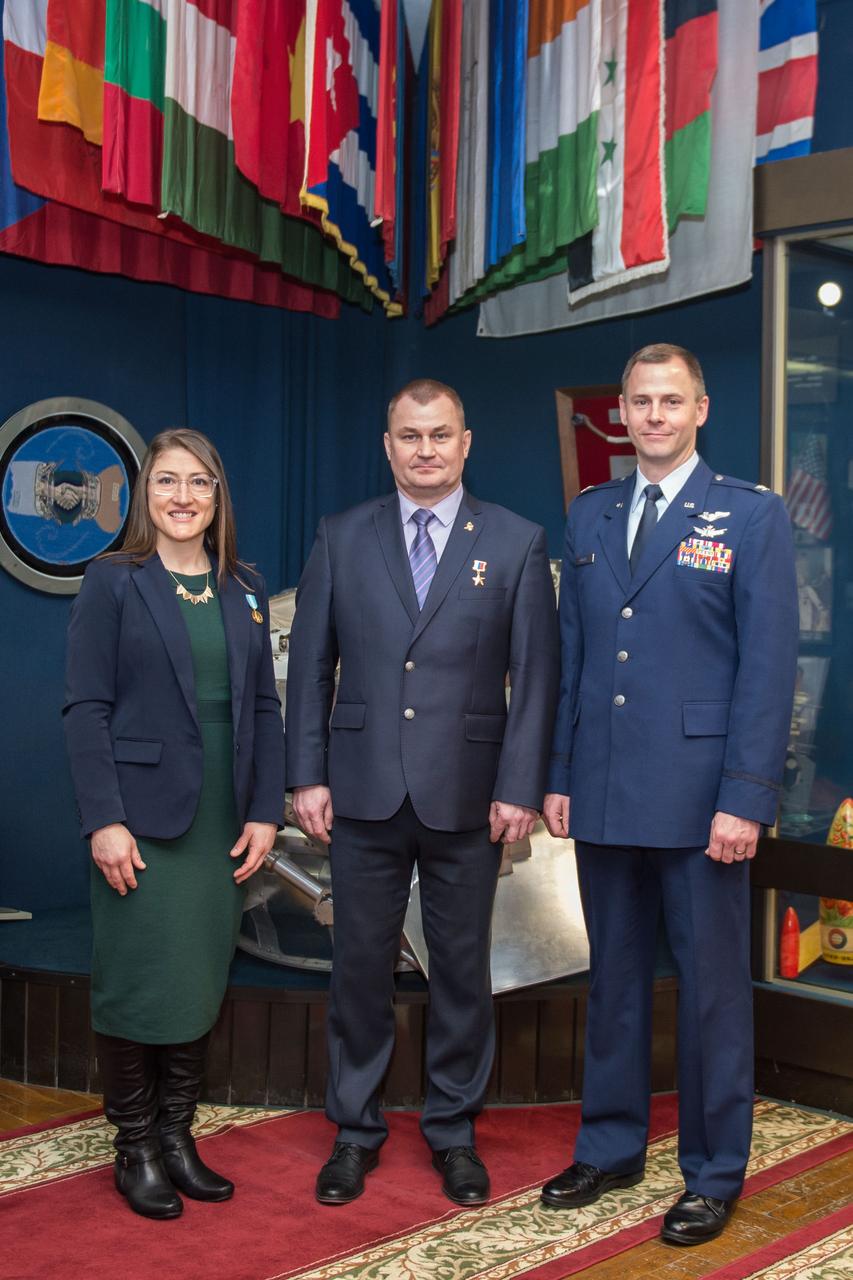 At the Gagarin Museum in the Gagarin Cosmonaut Training Center in Star City, Russia, Expedition 59 crewmembers Christina Koch of NASA (left), Alexey Ovchinin of Roscosmos (center) and Nick Hague of NASA (right) pose for pictures Feb. 21 following a pre-launch news conference. They will launch March 14, U.S. time, on the Soyuz MS-12 spacecraft from the Baikonur Cosmodrome in Kazakhstan for a six-and-a-half month mission on the International Space Station. Irina Spektor/Gagarin Cosmonaut Training Center