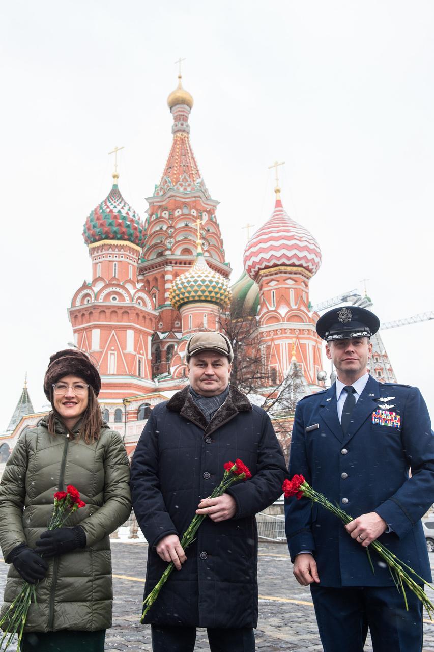 With St. Basilâ€™s Cathedral in Red Square in Moscow providing a wintry backdrop, Expedition 59 crewmembers Christina Koch of NASA (left), Alexey Ovchinin of Roscosmos (center) and Nick Hague of NASA (right) pose for pictures Feb. 21 prior to the ceremonial laying of flowers at the Kremlin Wall. They will launch March 14, U.S. time, on the Soyuz MS-12 spacecraft from the Baikonur Cosmodrome in Kazakhstan for a six-and-a-half month mission on the International Space Station.  Andrey Shelepin/Gagarin Cosmonaut Training Center 