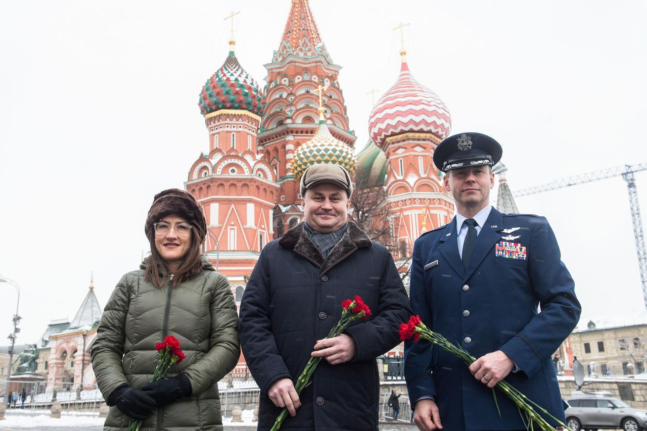 With St. Basilâ€™s Cathedral in Red Square in Moscow providing a wintry backdrop, Expedition 59 crewmembers Christina Koch of NASA (left), Alexey Ovchinin of Roscosmos (center) and Nick Hague of NASA (right) pose for pictures Feb. 21 prior to the ceremonial laying of flowers at the Kremlin Wall. They will launch March 14, U.S. time, on the Soyuz MS-12 spacecraft from the Baikonur Cosmodrome in Kazakhstan for a six-and-a-half month mission on the International Space Station.  Andrey Shelepin/Gagarin Cosmonaut Training Center 