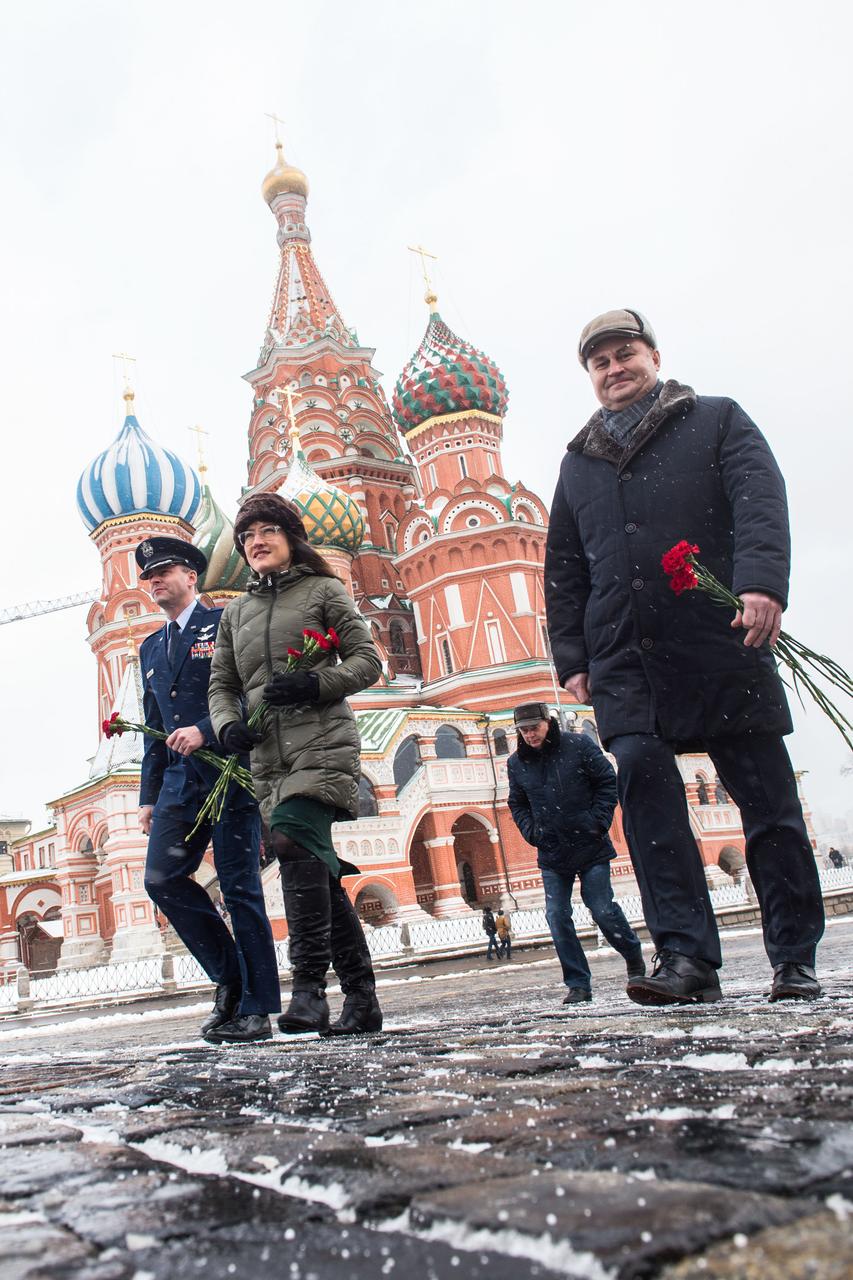 With St. Basilâ€™s Cathedral in Red Square in Moscow providing a wintry backdrop, Expedition 59 crewmembers Nick Hague of NASA (left), Christina Koch of NASA (center) and Alexey Ovchinin of Roscosmos (right) walk toward the Kremlin Wall Feb. 21 prior to the ceremonial laying of flowers. They will launch March 14, U.S. time, on the Soyuz MS-12 spacecraft from the Baikonur Cosmodrome in Kazakhstan for a six-and-a-half month mission on the International Space Station.  Andrey Shelepin/Gagarin Cosmonaut Training Center 