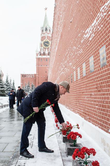 NASA image: jsc2019e004434 - At the Kremlin Wall in Moscow, Expedition 59 crewmember Alexey Ovchinin of Roscosmos lays flowers where Russian space icons are interred in traditional ceremonies Feb. 21. Ovchinin and Nick Hague and Christina Koch of NASA will launch Mar
