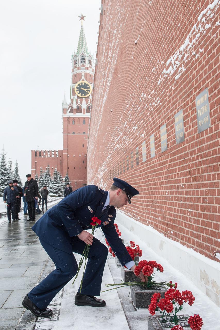 At the Kremlin Wall in Moscow, Expedition 59 crewmember Nick Hague of NASA lays flowers where Russian space icons are interred in traditional ceremonies Feb. 21. Hague, Alexey Ovchinin of Roscosmos and Christina Koch of NASA will launch March 14, U.S. time, on the Soyuz MS-12 spacecraft from the Baikonur Cosmodrome in Kazakhstan for a six-and-a-half month mission on the International Space Station.  Andrey Shelepin/Gagarin Cosmonaut Training Center 