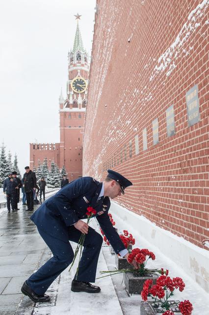 NASA image: jsc2019e004435 - At the Kremlin Wall in Moscow, Expedition 59 crewmember Nick Hague of NASA lays flowers where Russian space icons are interred in traditional ceremonies Feb. 21. Hague, Alexey Ovchinin of Roscosmos and Christina Koch of NASA will launch M