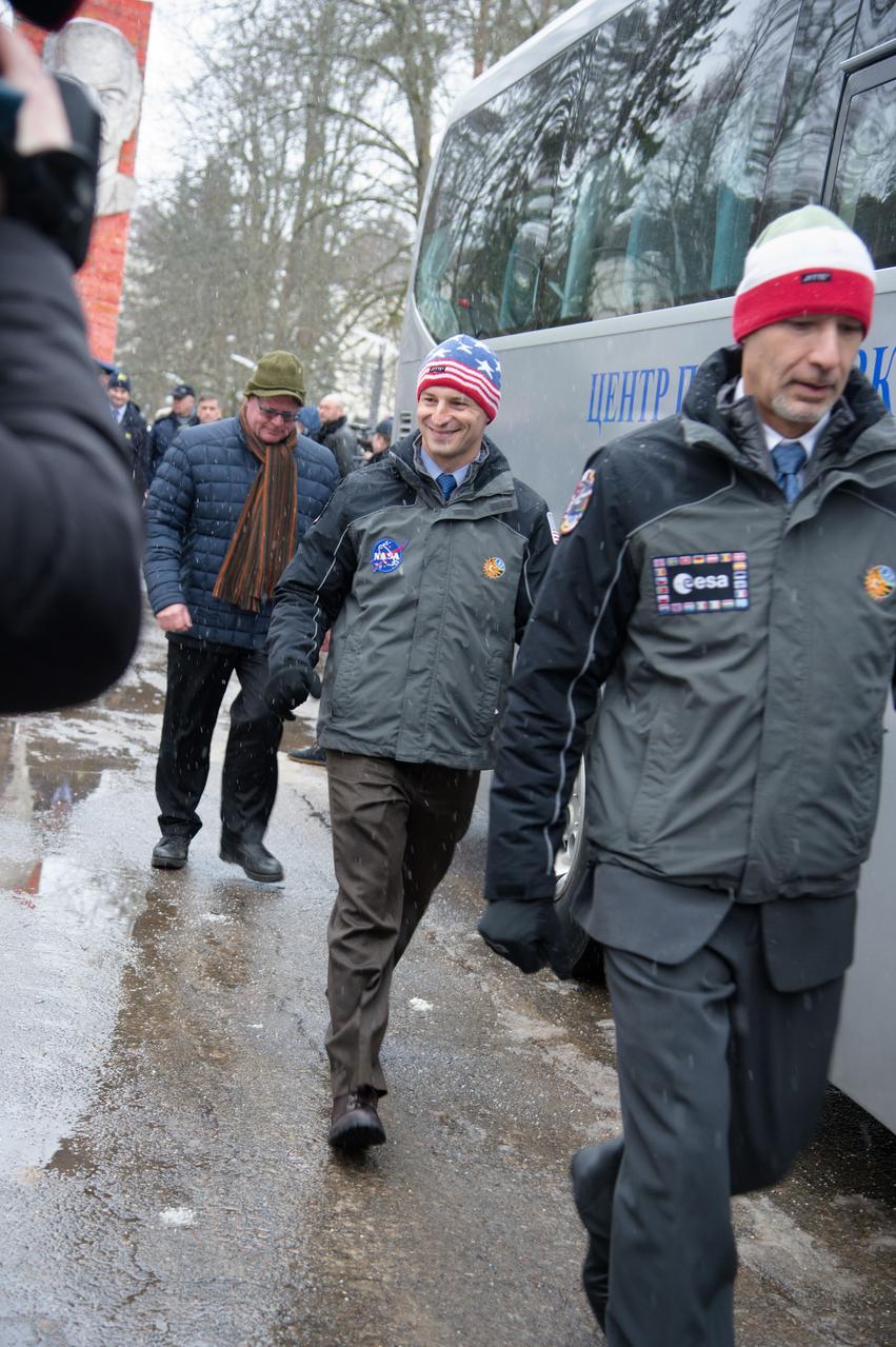 At the Gagarin Cosmonaut Training Center in Star City, Russia, Expedition 59 backup crewmembers Drew Morgan of NASA (center) and Luca Parmitano of the European Space Agency (right) walk to a bus Feb. 26 to take them to their plane for a flight to the Baikonur Cosmodrome in Kazakhstan for final pre-launch training. They and Alexander Skvortsov of Roscosmos are the backups to the prime crew, Nick Hague and Christina Koch of NASA and Alexey Ovchinin of Roscosmos, who will launch on March 14, U.S. time, on the Soyuz MS-12 spacecraft from the Baikonur Cosmodrome in Kazakhstan for a six-and-a-half month mission on the International Space Station.  NASA/Beth Weissinger 