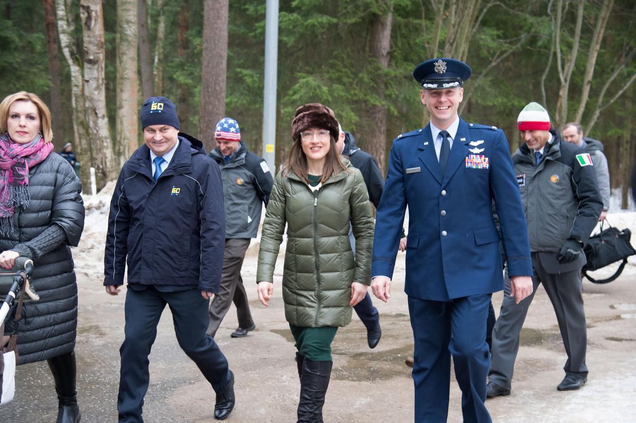 At the Gagarin Cosmonaut Training Center in Star City, Russia, Expedition 59 crewmembers Alexey Ovchinin of Roscosmos (second from left), Christina Koch of NASA (second from right) and Nick Hague of NASA (right) walk to a bus Feb. 26 to take them to their plane for a flight to their launch site at the Baikonur Cosmodrome in Kazakhstan for final pre-launch training. They will launch on March 14, U.S. time, on the Soyuz MS-12 spacecraft from the Baikonur Cosmodrome in Kazakhstan for a six-and-a-half month mission on the International Space Station.  NASA/Beth Weissinger 