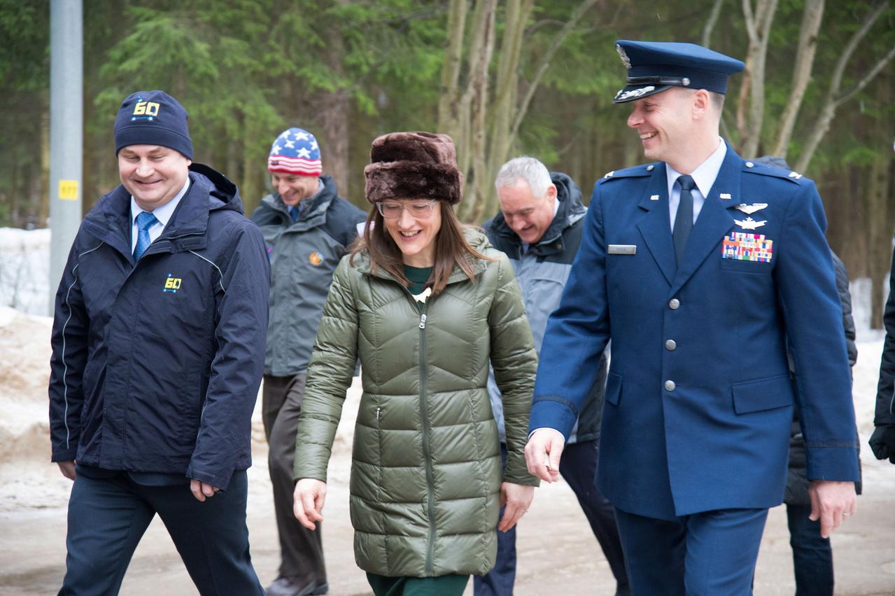 At the Gagarin Cosmonaut Training Center in Star City, Russia, Expedition 59 crewmembers Alexey Ovchinin of Roscosmos (left), Christina Koch of NASA (center) and Nick Hague of NASA (right) walk to a bus Feb. 26 to take them to their plane for a flight to their launch site at the Baikonur Cosmodrome in Kazakhstan for final pre-launch training. They will launch on March 14, U.S. time, on the Soyuz MS-12 spacecraft from the Baikonur Cosmodrome in Kazakhstan for a six-and-a-half month mission on the International Space Station.  NASA/Beth Weissinger 