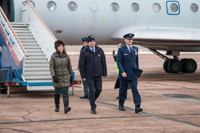 NASA image: jsc2019e007200 - Expedition 59 crewmembers Christina Koch of NASA (left), Alexey Ovchinin of Roscosmos (center) and Nick Hague of NASA (right) arrive at the Baikonur Cosmodrome in Kazakhstan Feb. 26 for final pre-launch training following a flight from th