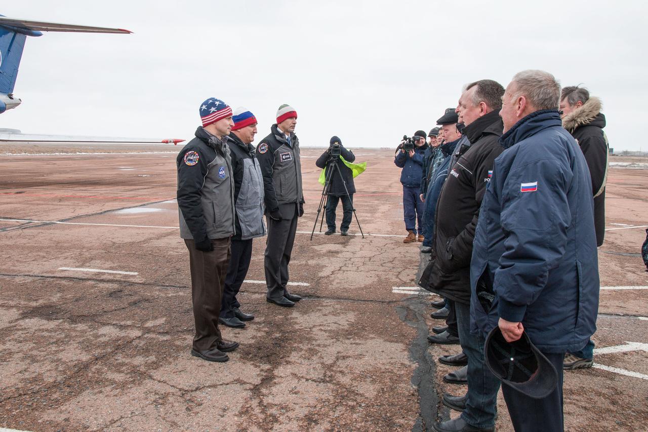 Expedition 59 backup crewmembers Drew Morgan of NASA (left), Alexander Skvortsov of Roscosmos (center) and Luca Parmitano of the European Space Agency (right) meet with Russian officials Feb. 26 after arriving at the Baikonur Cosmodrome in Kazakhstan for final pre-launch training following a flight from their training base in Star City, Russia. They are the backups to the prime crew, Nick Hague of NASA, Christina Koch of NASA and Alexey Ovchinin of Roscosmos, who will launch March 14, U.S. time, on the Soyuz MS-12 spacecraft from the Baikonur Cosmodrome in Kazakhstan for a six-and-a-half month mission on the International Space Station. NASA/Victor Zelentsov