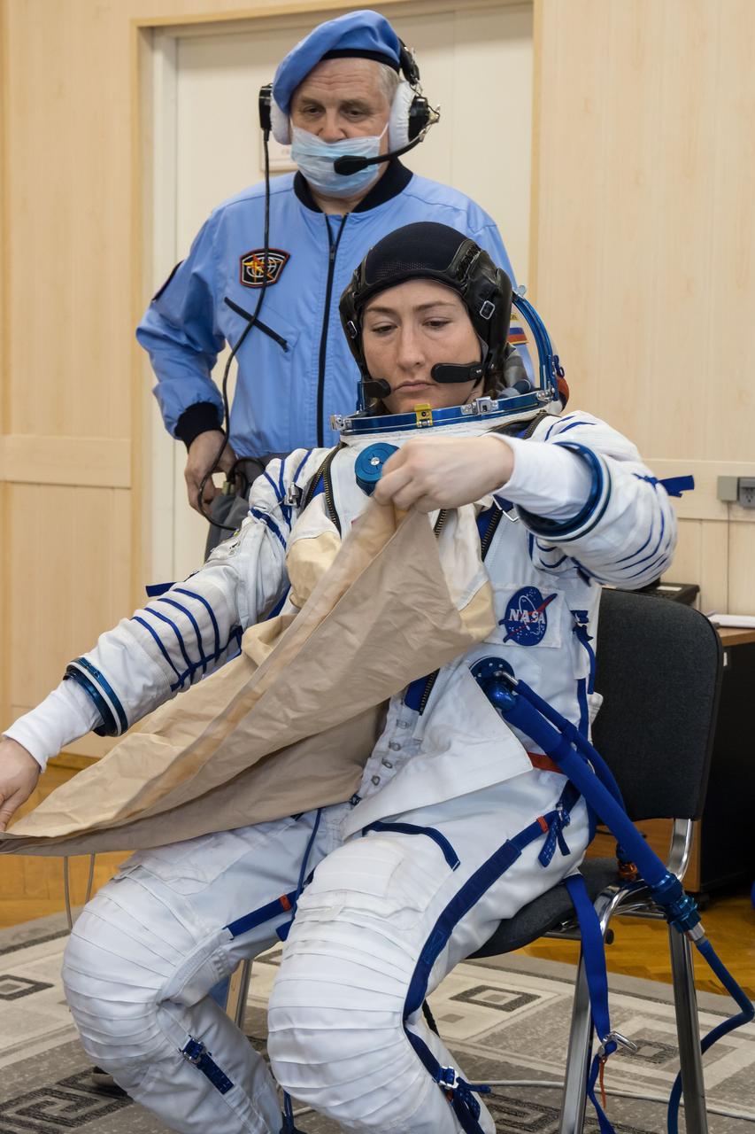 At the Baikonur Cosmodrome in Kazakhstan, Expedition 59 crewmember Christina Koch of NASA suits up for a Soyuz fit check dress rehearsal Feb. 27 during pre-launch training. Koch, Nick Hague of NASA and Alexey Ovchinin of Roscosmos will launch March 14, U.S. time, on the Soyuz MS-12 spacecraft from the Baikonur Cosmodrome in Kazakhstan for a six-and-a-half month mission on the International Space Station. NASA/Victor Zelentsov